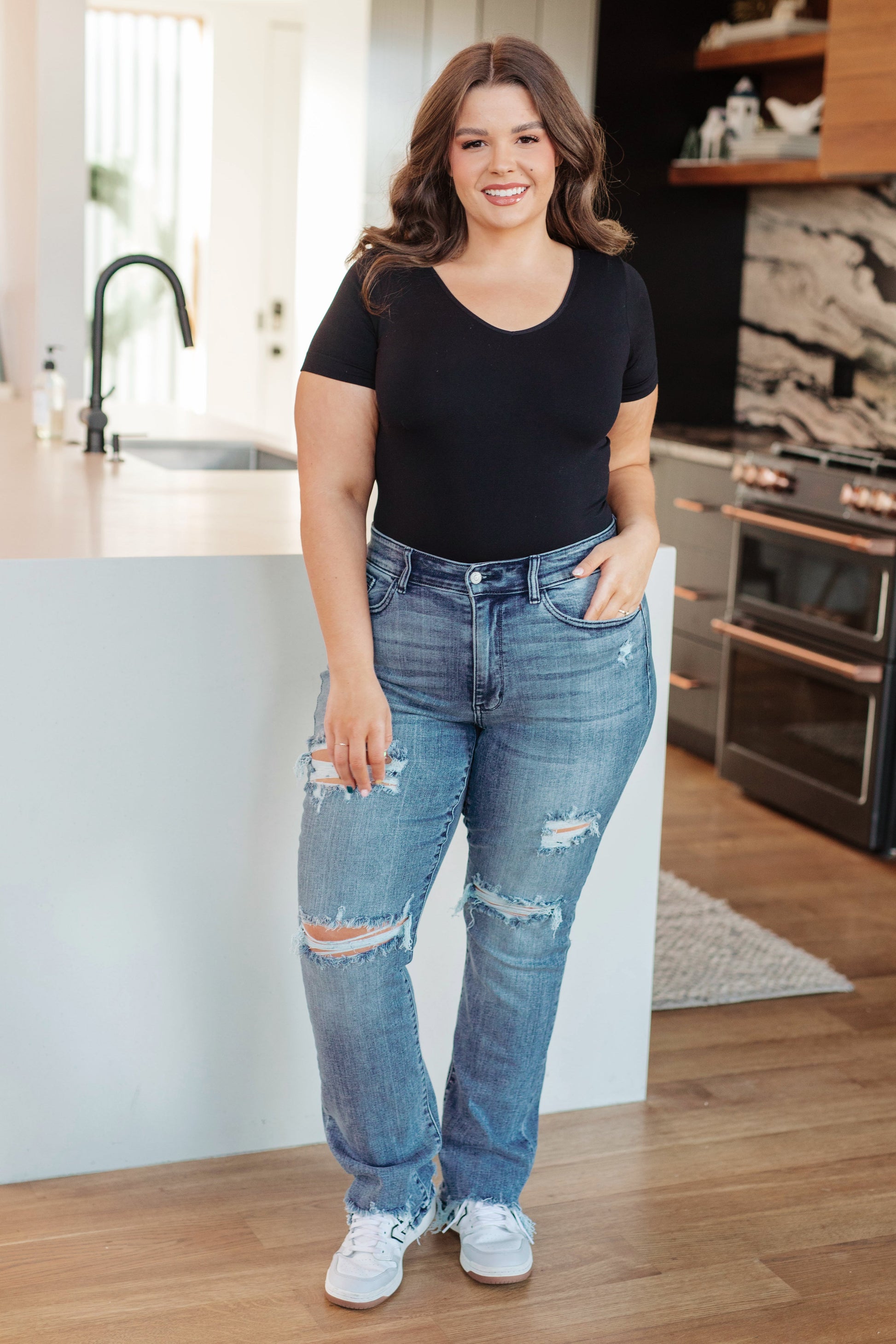 The O'Hara Destroyed Straight Jeans have the perfect balance of style, versatility, and timelessness! Featuring a stretch denim that shapes a mid rise waist with a five pocket cut and zipper fly. A slim fit through the thigh flares out at the ankle creating a straight cut silhouette. To top it off- these jeans have the perfect amount of distressing for an effortless cool girl look! 0 -24W