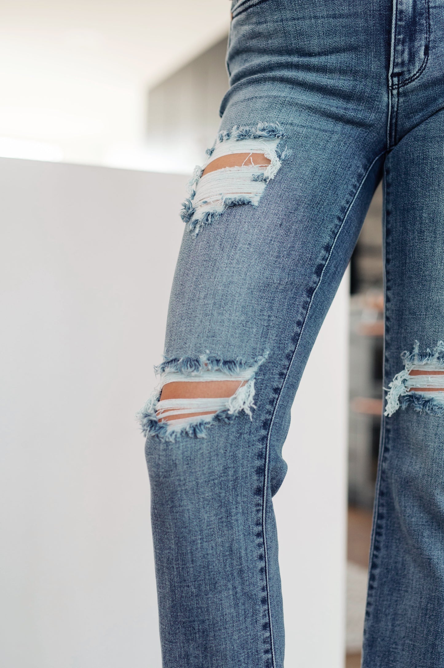 The O'Hara Destroyed Straight Jeans have the perfect balance of style, versatility, and timelessness! Featuring a stretch denim that shapes a mid rise waist with a five pocket cut and zipper fly. A slim fit through the thigh flares out at the ankle creating a straight cut silhouette. To top it off- these jeans have the perfect amount of distressing for an effortless cool girl look! 0 -24W