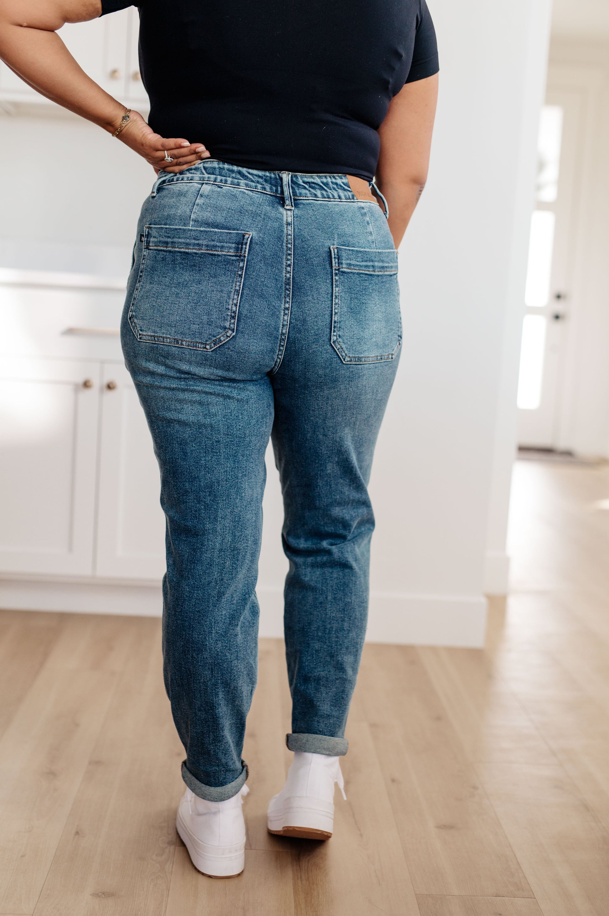 Experience the perfect fit and style in the Payton Pull-On Denim Joggers from Judy Blue! Made with a high rise and zero distressing, these medium-wash joggers offer an elastic waistband, functional drawstring, and patch pockets for a comfortable, adjustable fit. With an optional rolled cuff, you'll look and feel effortlessly chic. Are you ready to feel confident and stylish? Try Payton Pull-On Denim Joggers today! 0 -24W