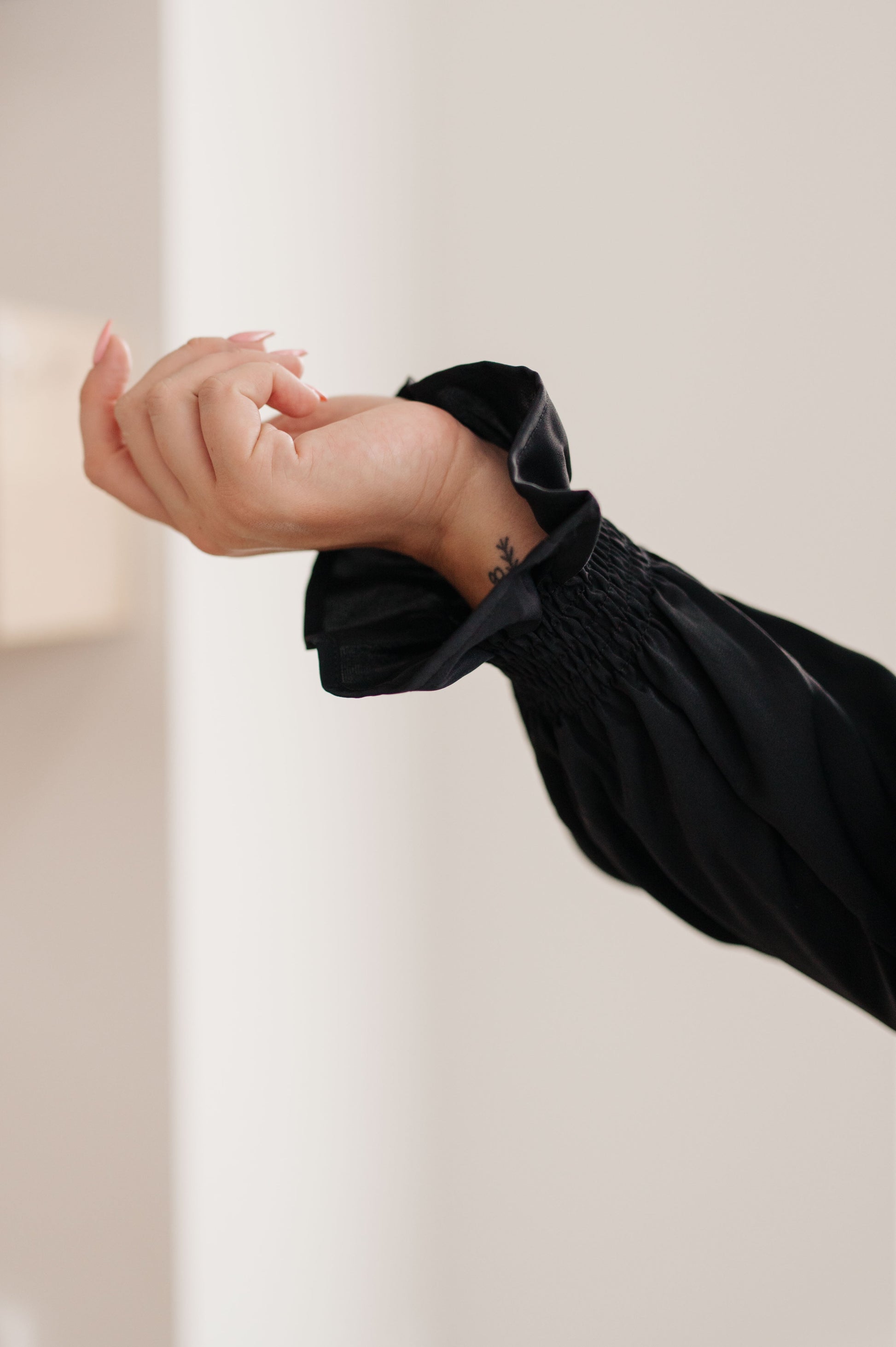 Look and feel your best, no matter the occasion, with our Peaceful Moments Smocked Sleeve Blouse. This go-to blouse has a smocked elastic sleeve cuff for a cool ruffled accent, easily transitioning from office to date night. A wardrobe staple that will take you places! S - 3X