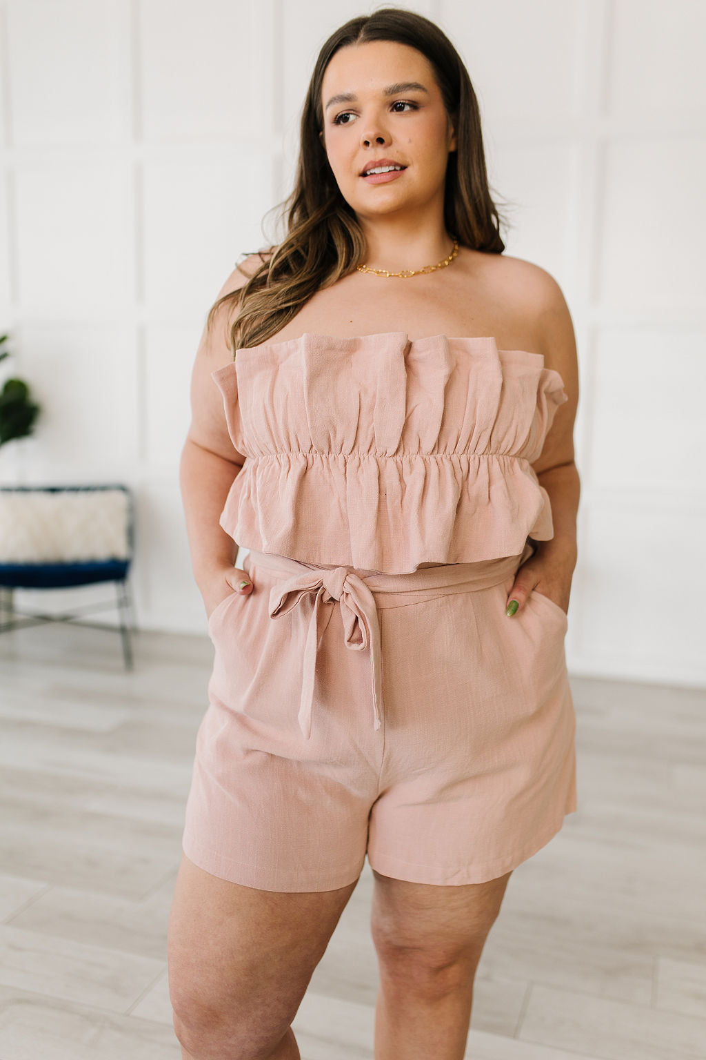 Let the Pink Skies Romper take you from day to night in style! This amazing strapless piece has adorable details like the ruffle pleated bust, tie waist, side pockets and shorts! Pair this with heels and a blazer for a daytime look then strip the blazer for date night! S - 3X