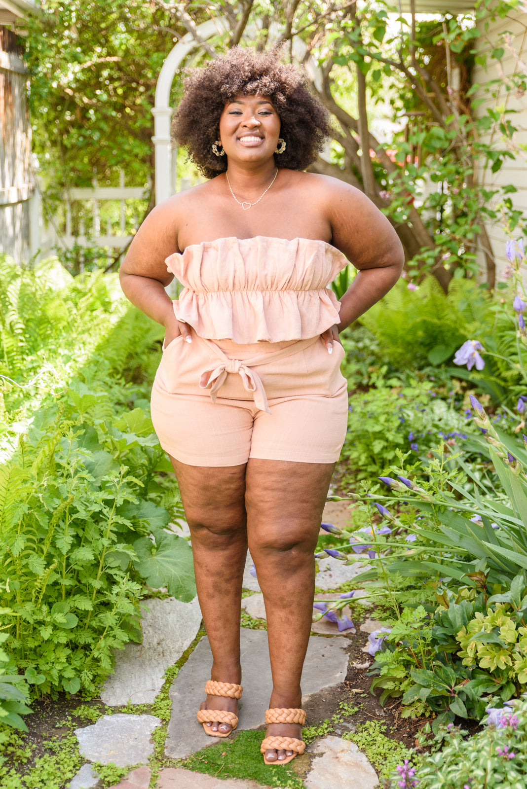 Let the Pink Skies Romper take you from day to night in style! This amazing strapless piece has adorable details like the ruffle pleated bust, tie waist, side pockets and shorts! Pair this with heels and a blazer for a daytime look then strip the blazer for date night! S - 3X
