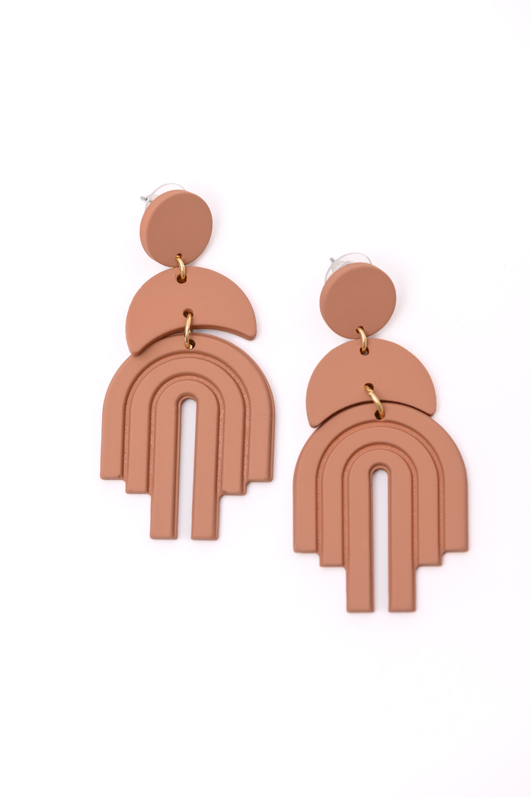 Wear this lovely pair of earrings as a reminder of all the good that is coming to you! This Promise Earrings in Brown, symbolic of a rainbow and new beginnings, the bold yet classic accessory you’ve been waiting for. Handmade with durable plastic, these beauties have the appearance of clay for a timeless finishing touch to every outfit.