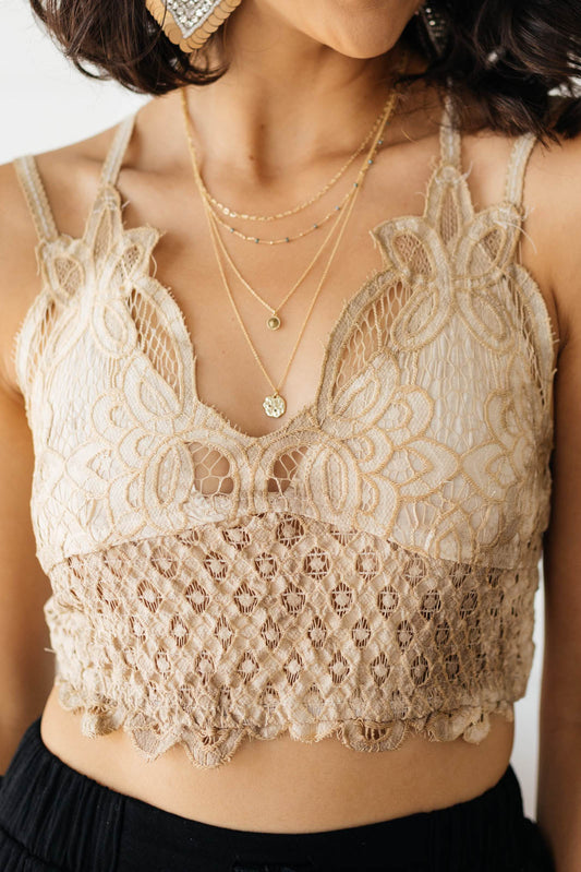 This beautiful lace bralette is perfect for layering. This lightweight, medium support bralette brings a feminine touch to any outfit. Pair it with a t-shirt or oversized sweater for a comfortable and flirty look! S - L