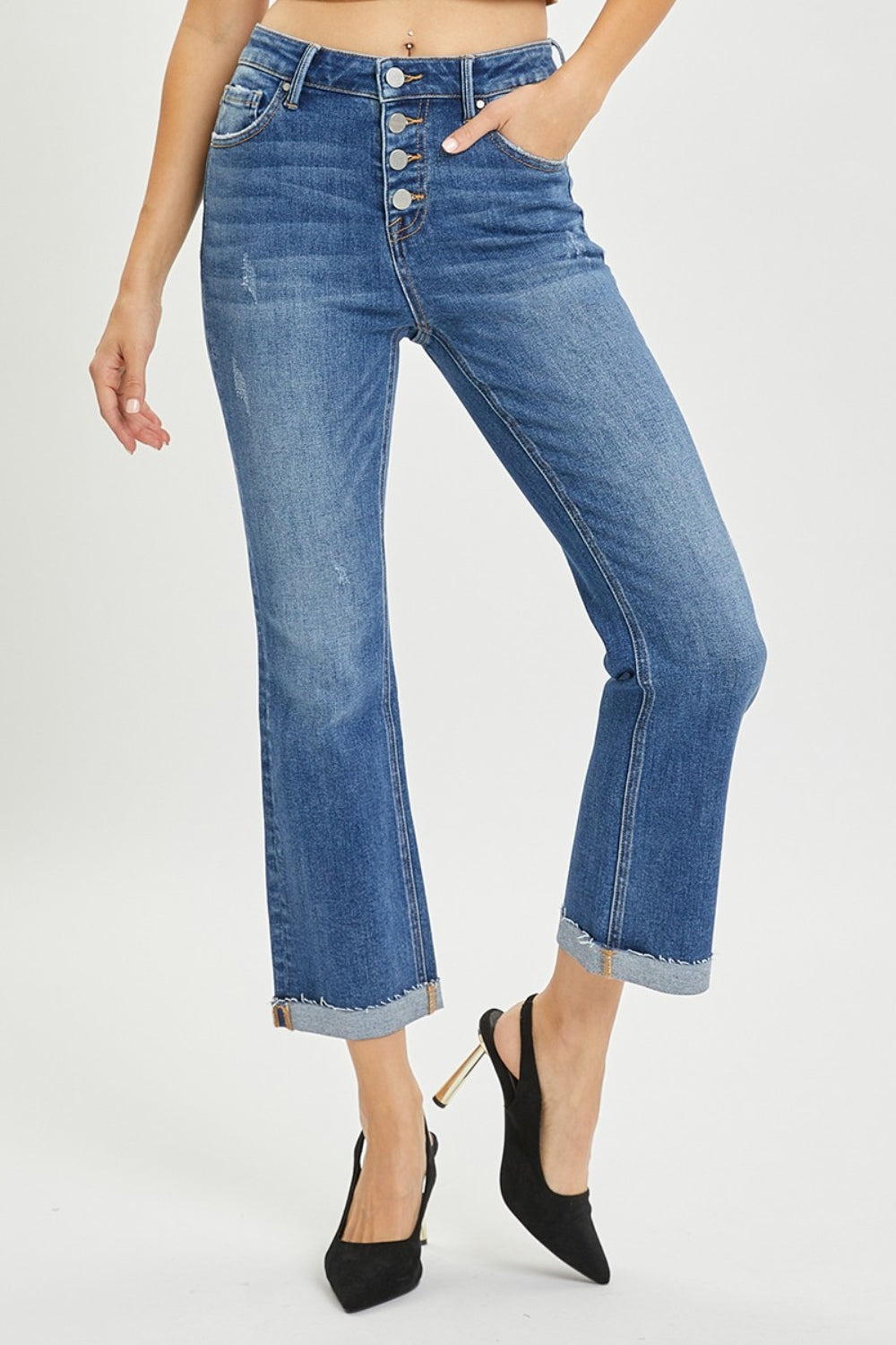 The Button-Fly Cropped Bootcut Jeans are a stylish and modern twist on a classic denim silhouette. The button fly closure adds a retro and chic touch to the cropped bootcut style. Made from high-quality denim fabric, these jeans are durable and comfortable for all-day wear. 0 - 3X