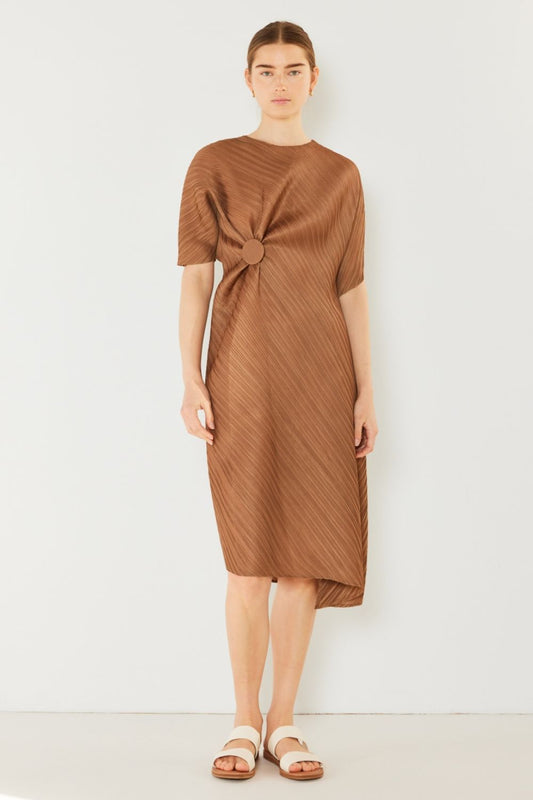 The Pleated Dolman Sleeve Dress is a modern and chic addition to your wardrobe. With its unique dolman sleeves and pleated detailing, this dress offers a stylish and sophisticated look. The relaxed silhouette and pleats create a flattering and comfortable fit.