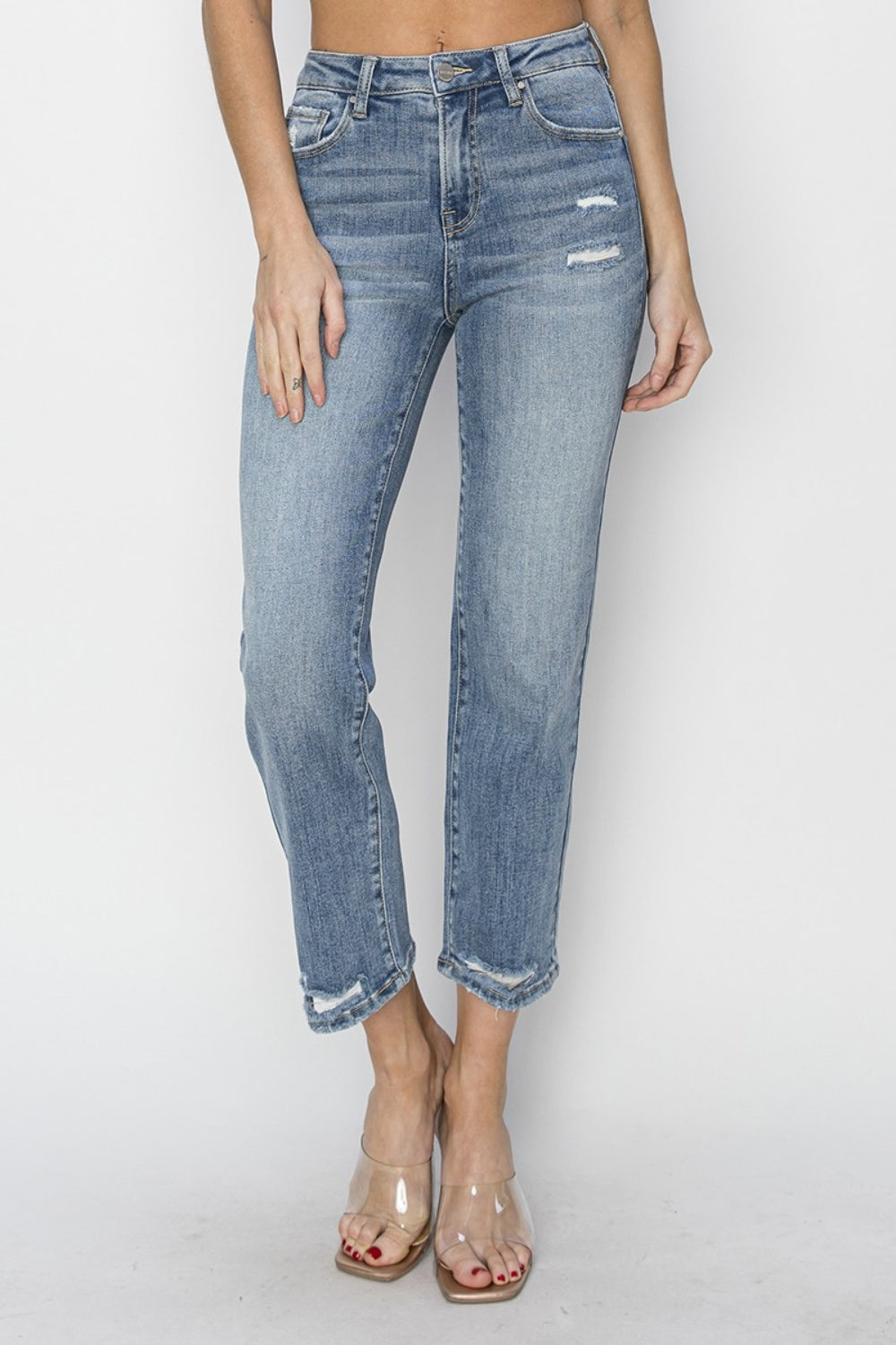The High Waist Distressed Cropped Jeans are a trendy and edgy addition to your denim collection. The high waist design offers a flattering and on-trend silhouette. The distressed detailing adds a cool and rugged vibe to the cropped jeans.