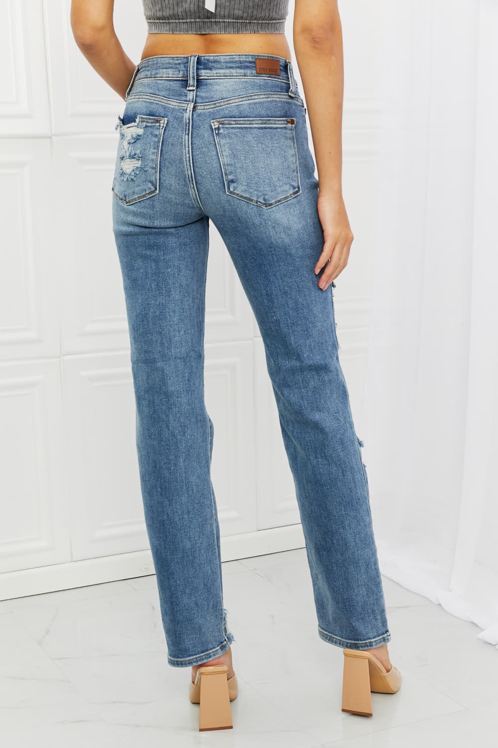 These jeans are the perfect combination of style and comfort, making them a must-have in every fashion-forward individual's wardrobe.The heavy distressing adds a touch of edginess to the classic straight-leg silhouette, making them perfect for a night out with the girls or a casual weekend brunch.
