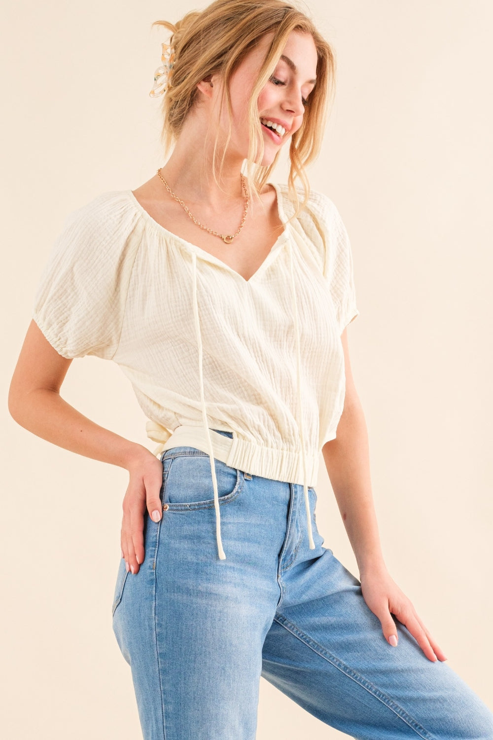 This Cotton Gauze Back Waist Tie Cropped Top is a stylish and versatile piece for your wardrobe. The back waist tie adds a unique touch to the design. Made with lightweight cotton gauze fabric, it is comfortable to wear in any season. S - XL