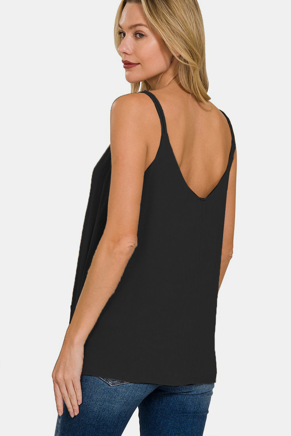 The Woven Double Spaghetti Strap V-Neck Cami is a stylish and versatile top that is perfect for layering or wearing on its own. The double spaghetti straps add a touch of sophistication and detail to the V-neckline. Made from woven fabric, this cami drapes beautifully and feels luxurious against the skin.  S  - L
