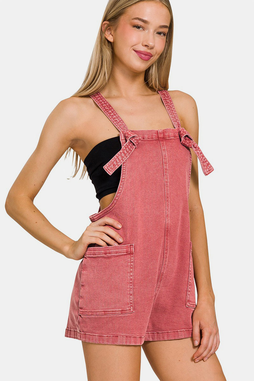 These Washed Knot Strap Rompers are the perfect blend of casual and chic style. The washed fabric gives them a relaxed and lived-in look, while the knot strap detail adds a touch of charm and uniqueness. S - L