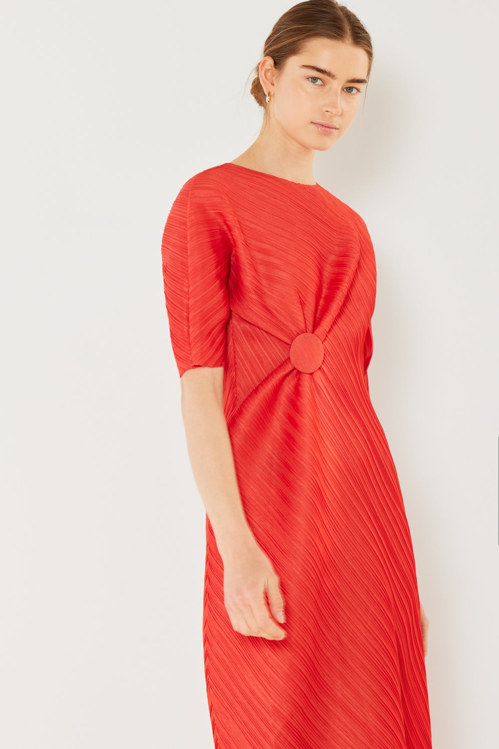 The Pleated Dolman Sleeve Dress is a modern and chic addition to your wardrobe. With its unique dolman sleeves and pleated detailing, this dress offers a stylish and sophisticated look. The relaxed silhouette and pleats create a flattering and comfortable fit.