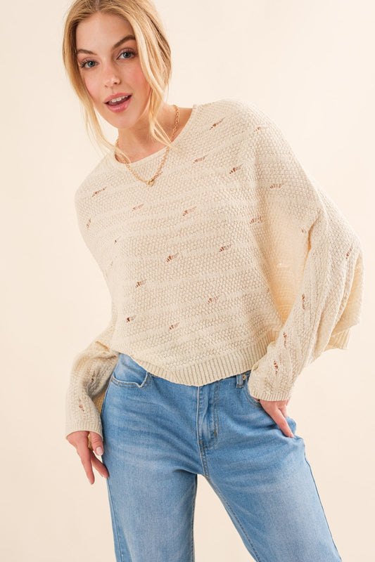 The Dolman Sleeves Sweater is a cozy and stylish addition to your wardrobe, perfect for the cooler months. The relaxed fit and dolman sleeves create a comfortable and effortless look that is both trendy and versatile. Crafted from soft and warm materials, this sweater is ideal for layering over a camisole or wearing on its own.