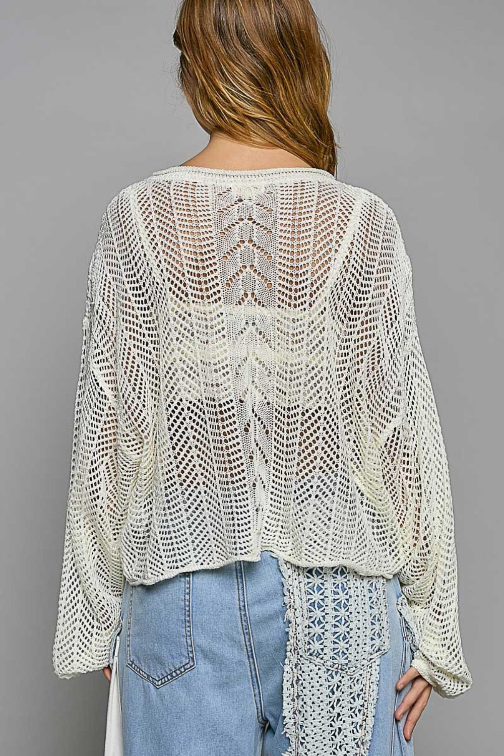 The Openwork Balloon Sleeve Knit Cover Up is a chic addition to any wardrobe. The intricate openwork detailing on the sleeves adds a touch of elegance and sophistication to this knit cover up. S - L