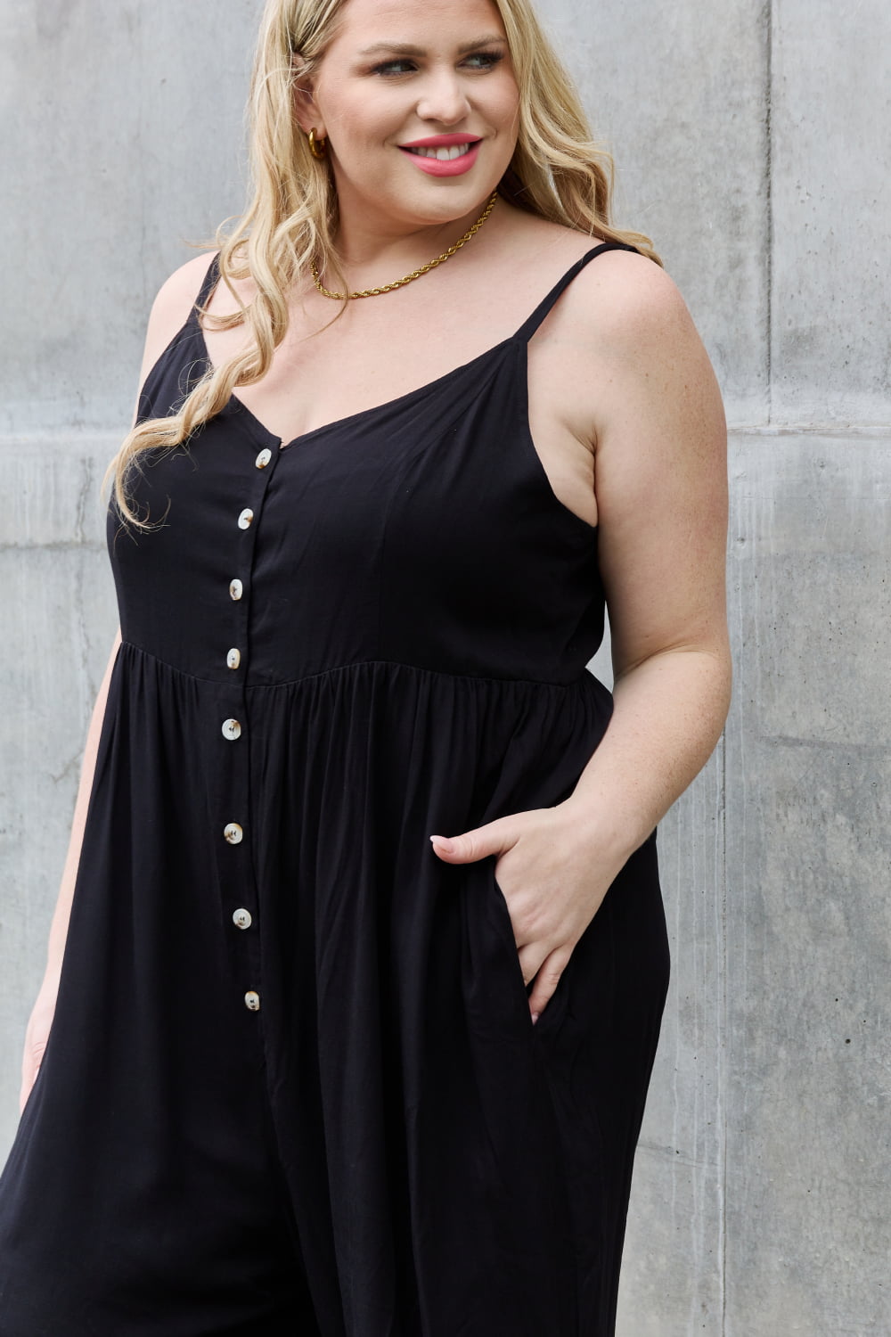 This jumpsuit is designed to be your go-to outfit for any occasion, whether you're running errands, attending a casual gathering, or simply lounging at home. This jumpsuit features a wide leg silhouette that not only offers a chic and contemporary look but also allows for unrestricted movement.