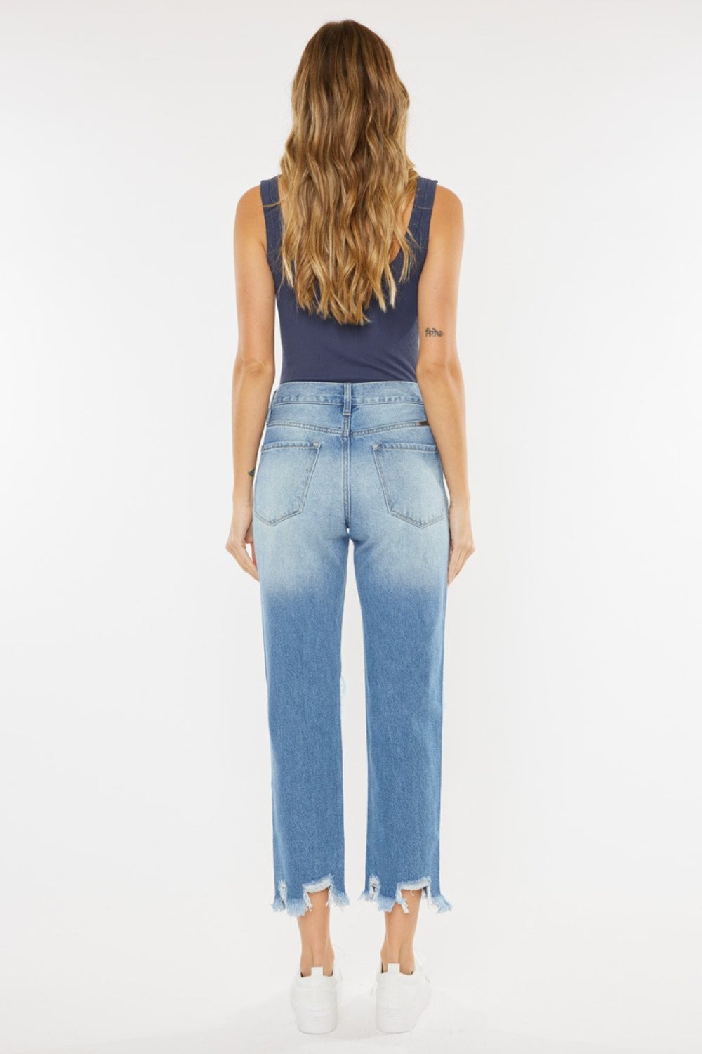 High Waist Chewed Up Straight Mom Jeans are the ultimate combination of vintage-inspired style and trendy edge. These jeans, with their high waistline, provide a flattering and comfortable fit that accentuates your curves.