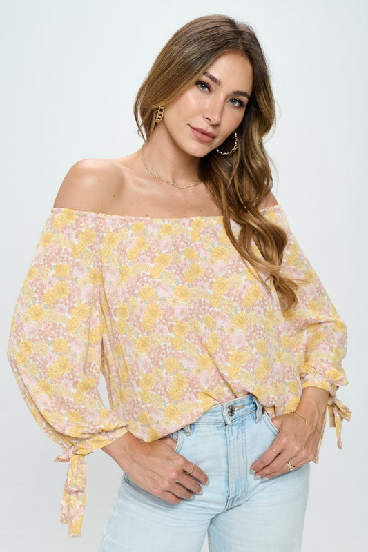 This floral off-shoulder long sleeve blouse is a stylish and feminine piece for any occasion. The off-shoulder design adds a flirty touch while showcasing your shoulders. The floral print gives a romantic and vibrant look to the blouse, perfect for spring or summer.  S - L