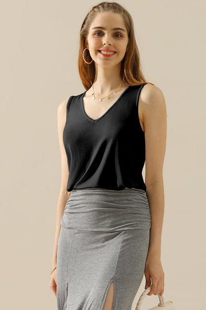 The V-Neck Curved Hem Tank is a stylish and versatile piece. With its flattering neckline and curved hem, it adds a touch of femininity to any outfit. The tank's relaxed fit provides comfort without sacrificing style. S - XL