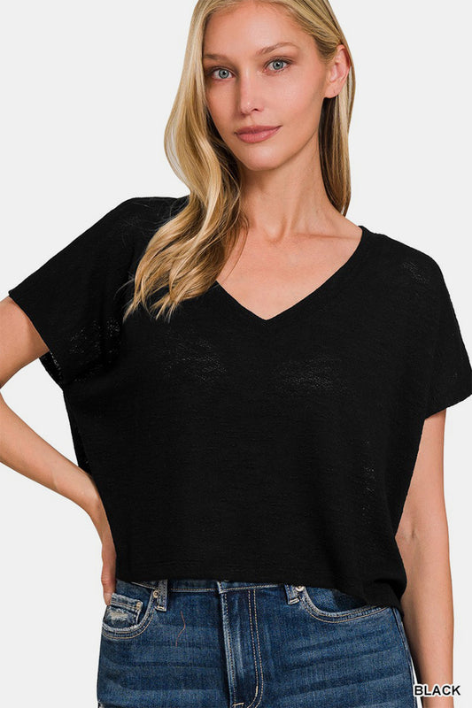 This V-Neck Short Sleeve Crop T-Shirt is a trendy and versatile piece for your wardrobe. The V-neck design adds a flattering touch to the top. With its short sleeves and cropped length, this t-shirt is perfect for warmer weather or for layering. Pair it with high-waisted bottoms for a stylish and on-trend look. Add a touch of casual flair to your outfit with this crop t-shirt that can easily be dressed up or down. Update your collection with this fashionable and comfortable V-neck crop t-shirt. S-XL