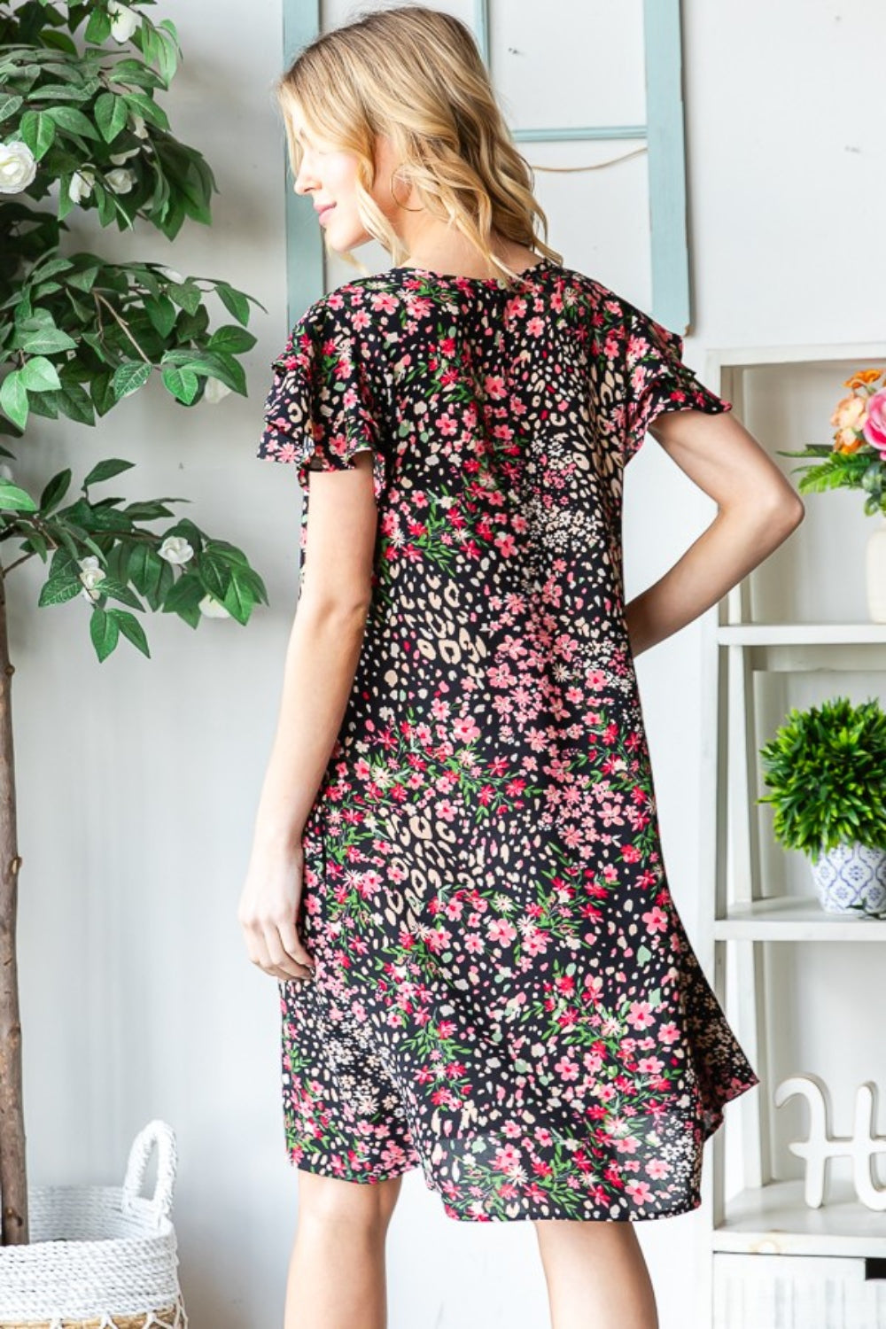 Get ready to turn heads in this stunning Printed Ruffled Short Sleeve Dress. With its eye-catching print and playful ruffled sleeves, this dress exudes feminine charm. The best part? It comes with pockets, adding a practical touch to this stylish piece. S  - 3X