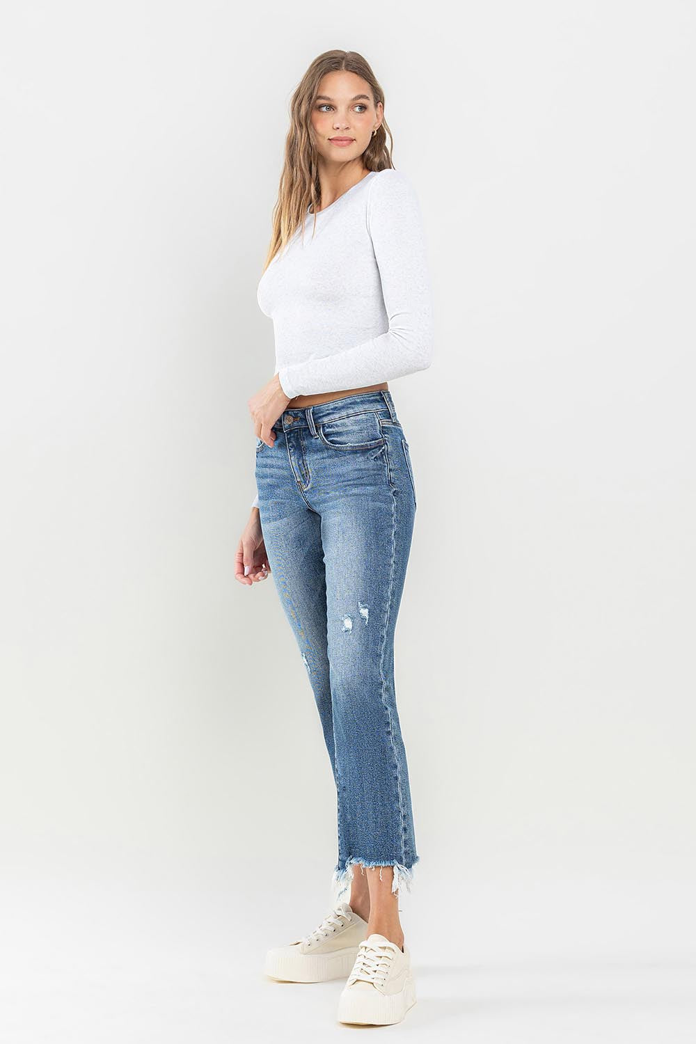 These mid rise frayed hem jeans are the perfect addition to any casual outfit. The frayed hem adds a trendy and edgy touch to the classic mid rise style. Made with high-quality denim, these jeans are both comfortable and durable. The mid rise waistline offers a flattering fit for all body types.
