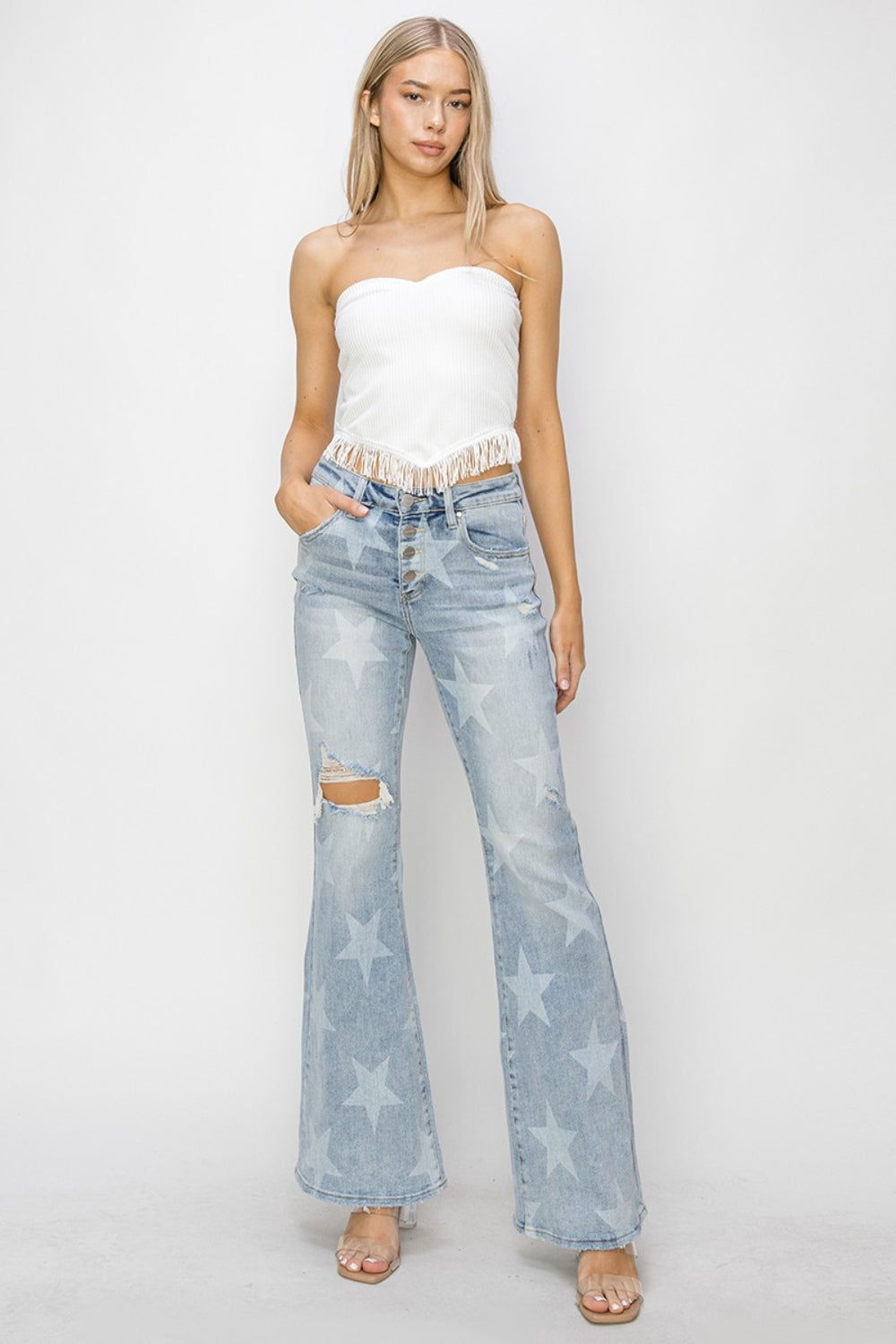 These Mid Rise Button Fly Star Print Flare Jeans are a unique and trendy addition to your denim collection. The mid-rise fit offers a flattering and comfortable silhouette, while the button fly adds a touch of vintage charm.  0 -15