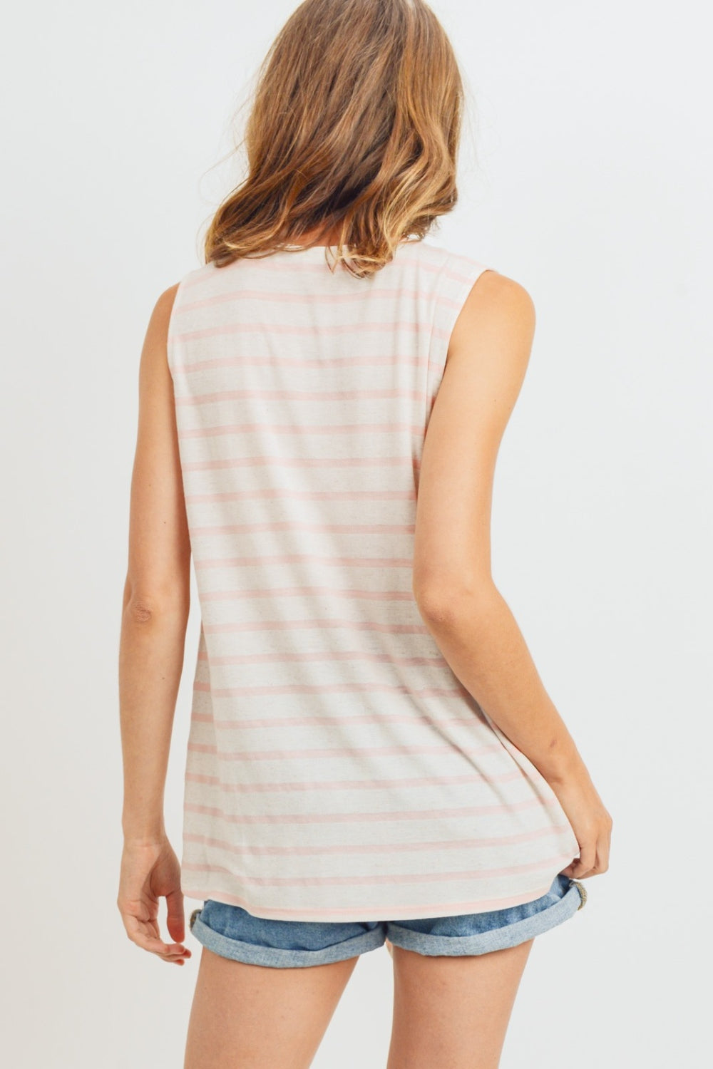 A sleeveless front tie striped top is a stylish and versatile piece for the warmer weather. This top typically features a sleeveless design, making it perfect for staying cool and comfortable on hot days. The front tie detail adds a fun and playful touch, allowing you to adjust the fit and create a customized look. S-XL