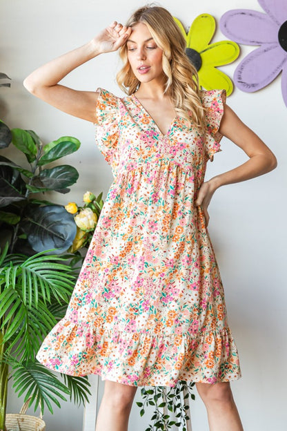 Introducing the Floral Ruffled V-Neck Dress. This stunning dress combines feminine elegance with a touch of playfulness. The floral pattern adds a romantic and vibrant flair, while the ruffled details create a whimsical and graceful look. S  - 3X