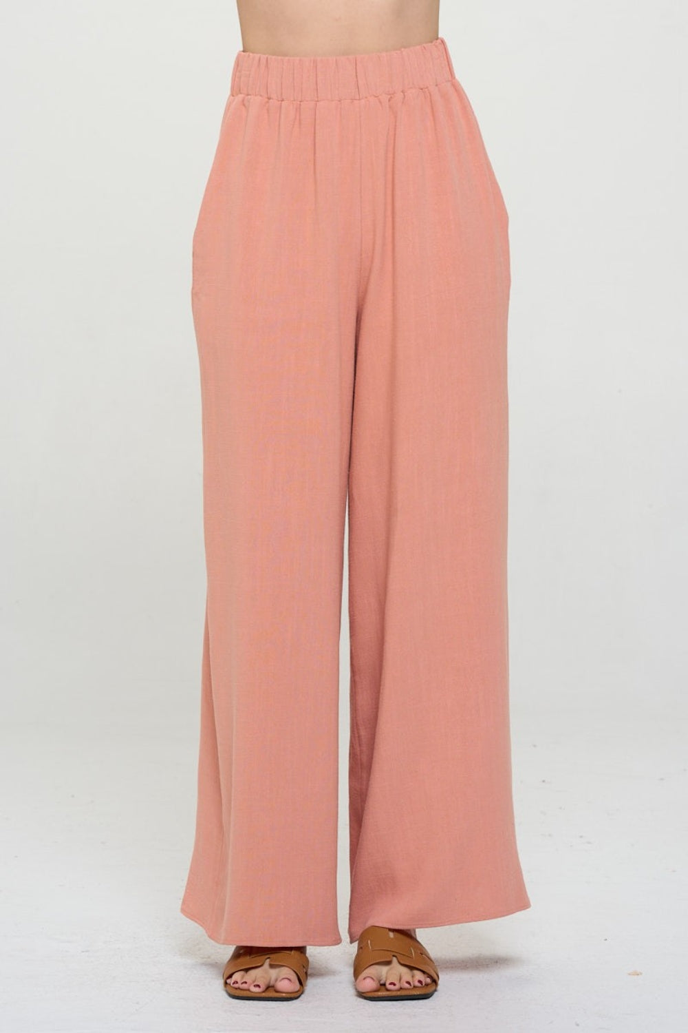 These linen wide leg pants are stylish and functional with the added convenience of pockets. Made from breathable linen fabric, they are perfect for keeping cool and comfortable during warm weather. The wide leg design adds a touch of elegance while allowing for ease of movement.  S  - L