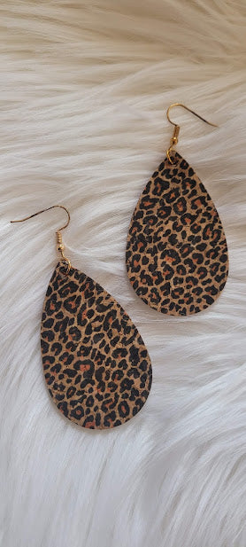 Little Bit Corky Teardrop Cheetah Earrings  Leopard print cork earrings Teardrop shape Brushed gold fish hook dangle earrings Rubber earring back Length 3” Whether you want to be on the wild side or classy this earring set it will add a fun touch to your outfit
