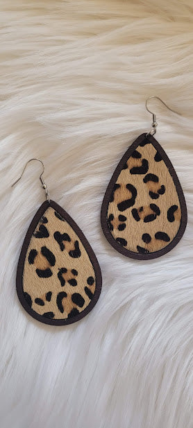 Tan Leopard Wood Teardrop Earrings  Dark brown wood Genuine leopard print leather Teardrop shape Silver fish hook Rubber earring back Whether you want to be on the wild side or classy this earring set it will add a fun touch to your outfit