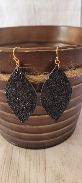 Black Sequin Marquise Earrings  Marquise shape Black glitter and sequins Brushed gold fish hook dangle earrings Rubber earring back Length 3” Whether you want to be on the wild side or classy this earring set it will add a fun touch to your outfit