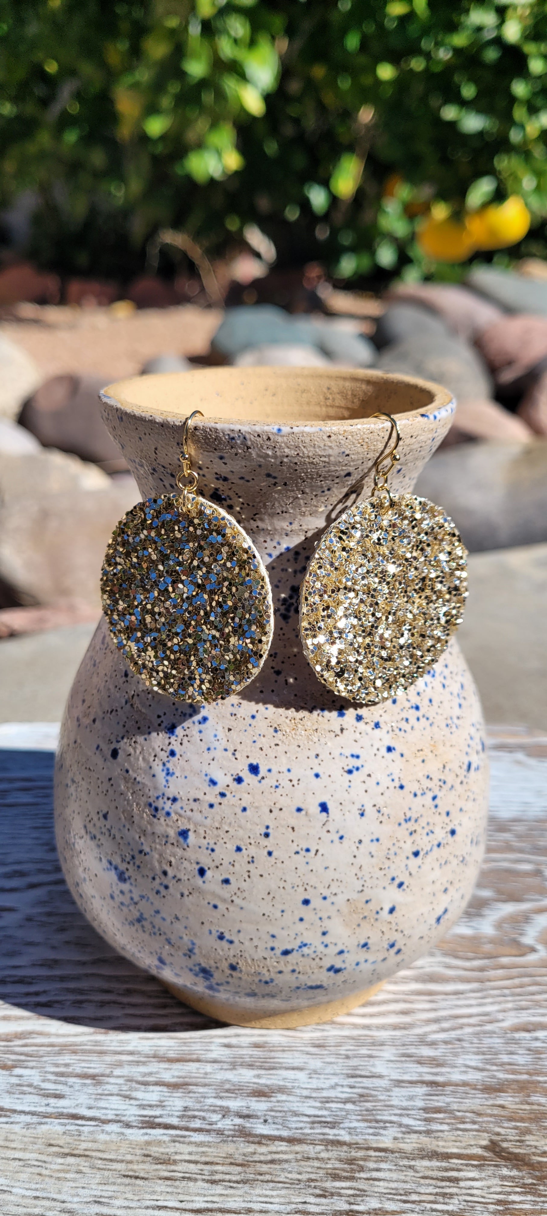 Circle shape Gold glitter and sequins Brushed gold fish hook dangle earrings Rubber earring back Diameter 1.5” Whether you want to be on the wild side or classy this earring set it will add a fun touch to your outfit