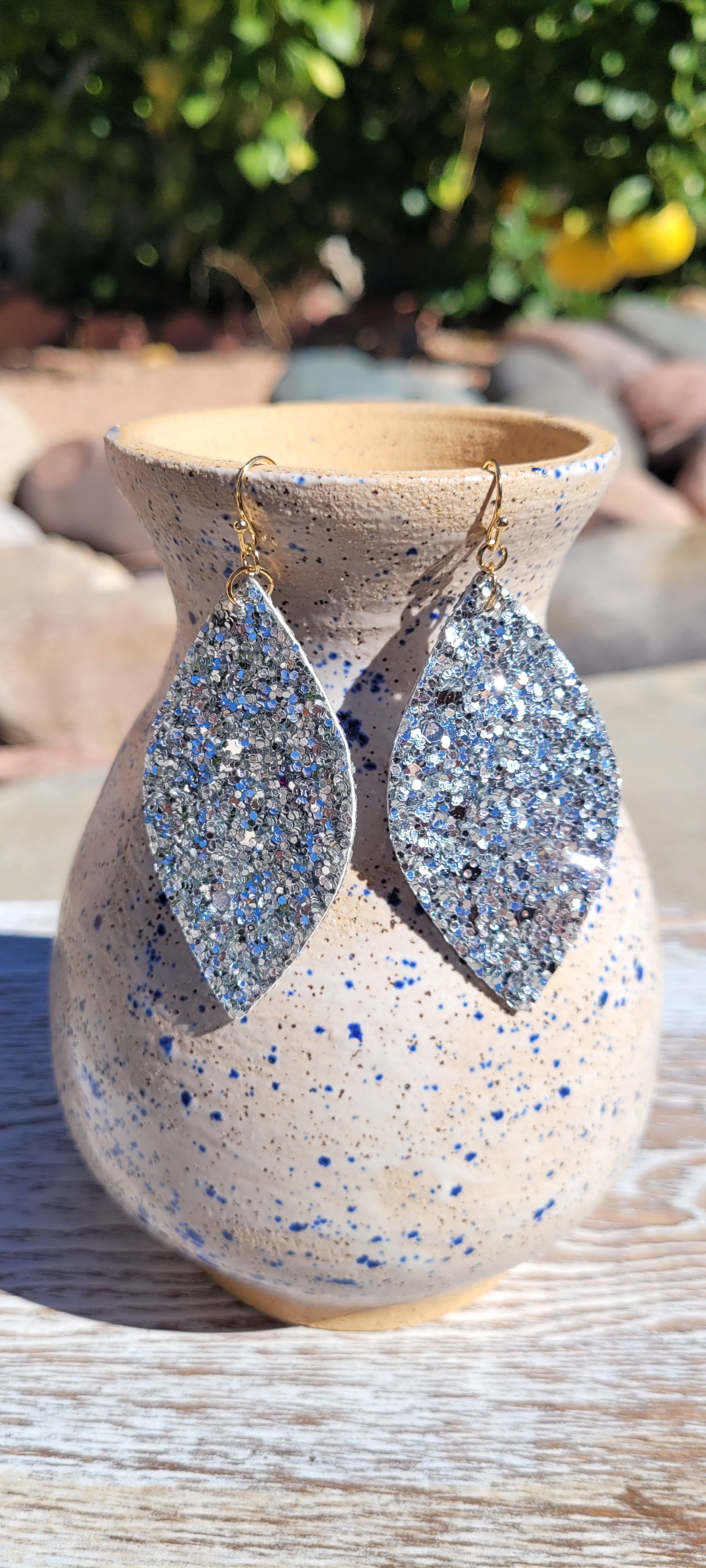 Marquise shape Silver glitter and sequins Brushed gold fish hook dangle earrings Rubber earring back Length 3” Whether you want to be on the wild side or classy this earring set it will add a fun touch to your outfit