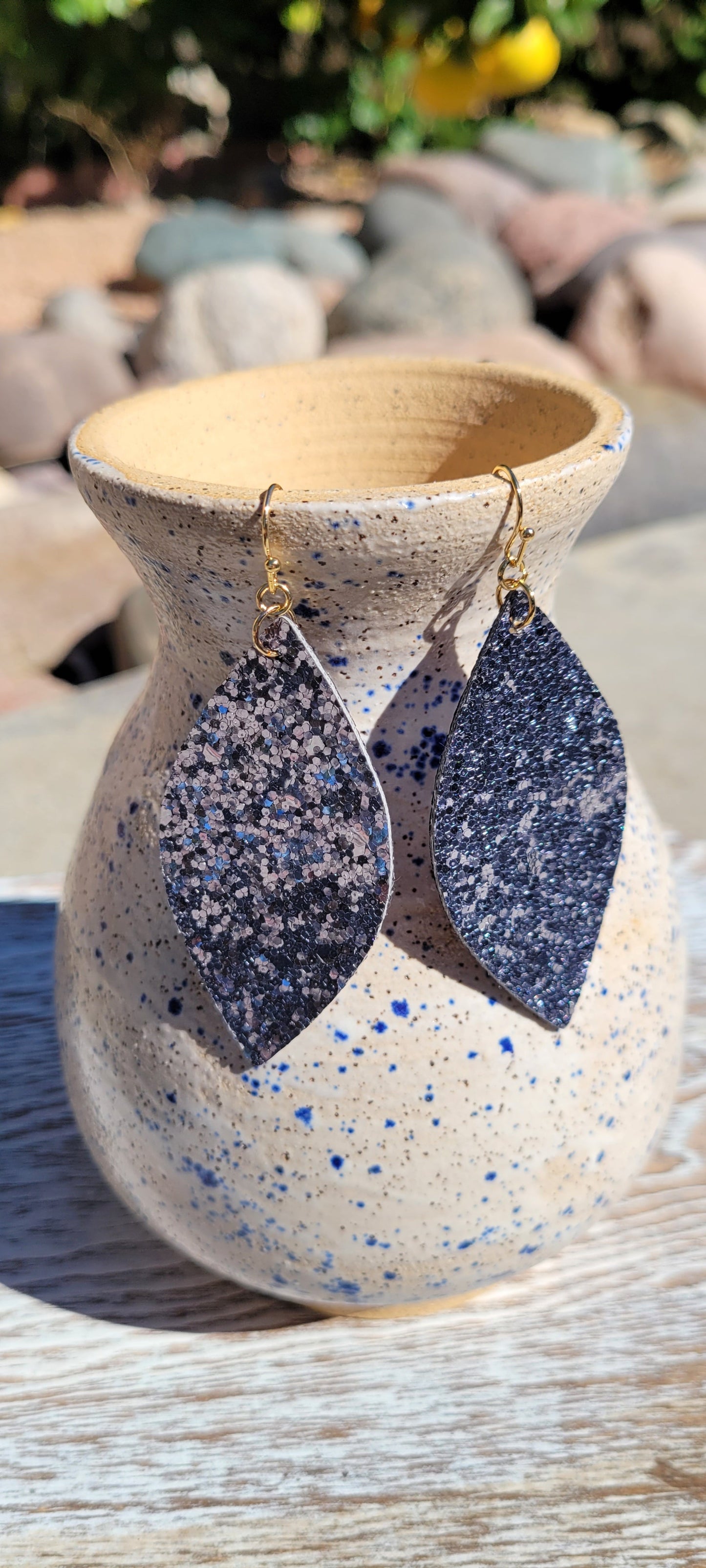 Marquise shape Pewter glitter and sequins Brushed gold fish hook dangle earrings Rubber earring back Length 3” Whether you want to be on the wild side or classy this earring set it will add a fun touch to your outfit