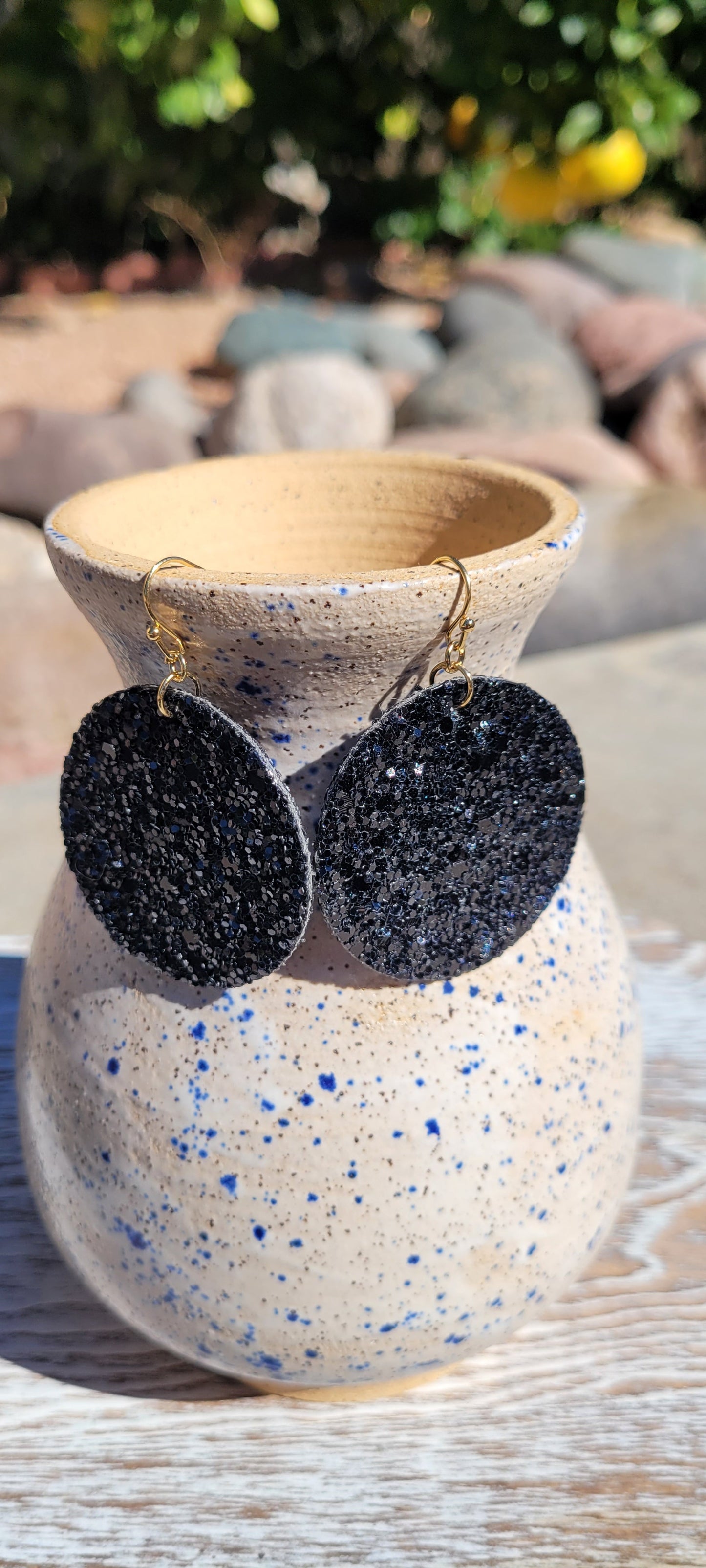 Circle shape Black glitter and sequins Brushed gold fish hook dangle earrings Rubber earring back Diameter 1.5” Whether you want to be on the wild side or classy this earring set it will add a fun touch to your outfit