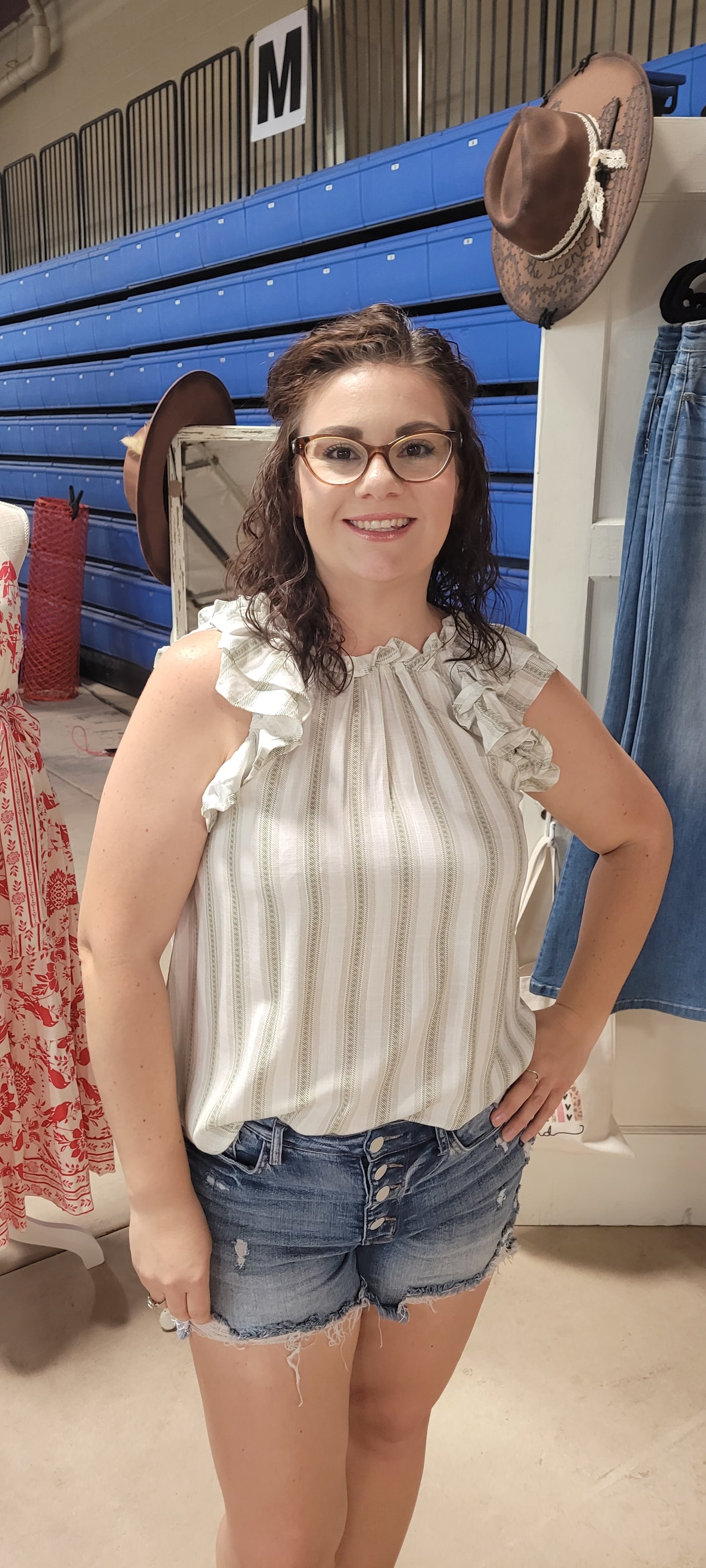 Take your style up a notch with the "Out For The Day" top! It's the perfect go-to for a day out, with a classy round neckline and chic double ruffle cap sleeves. Plus, the button with a keyhole at the back adds a touch of sass and a hint of mystery. Pop it on and get ready to turn heads! Sizes small through large.