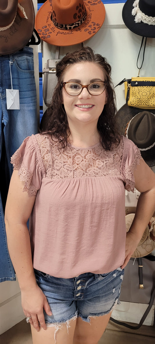 This top lets you express your fun side while looking your best. Put together pretty lace, a back keyhole button detail and a comfy round neckline, and you have the perfect top for any style! (Yeah, you might just have to stop and smell the roses, or in this case, the Dusty Rose Top!) Sizes small through large.