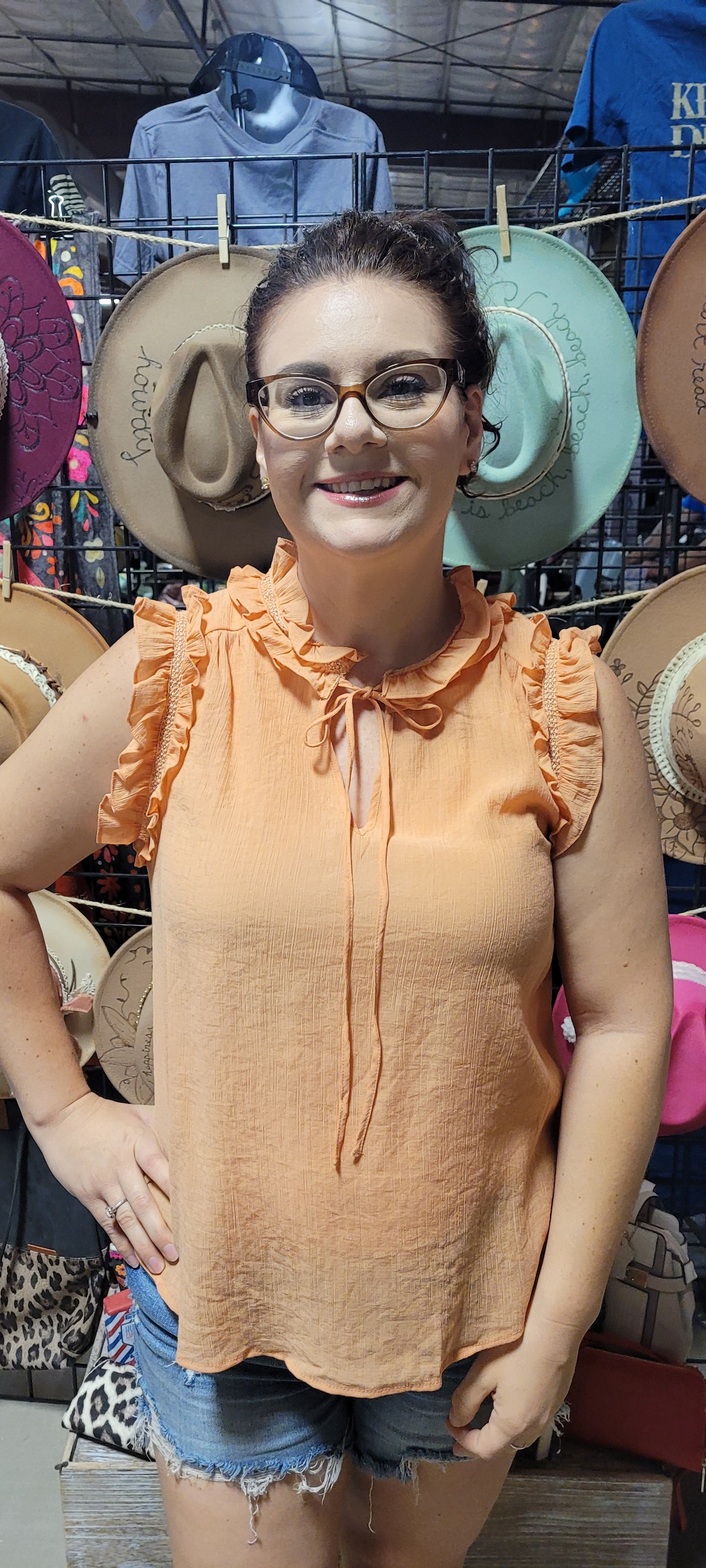 Make a splash this summer with this "Fun In The Sun Dusty Apricot" top! Indulge in the split neckline with self tie, and dance the day away with the ruffles and lace detail that flutter along the neck and arm openings. Time to unleash your carefree summer spirit! Sizes small through large.