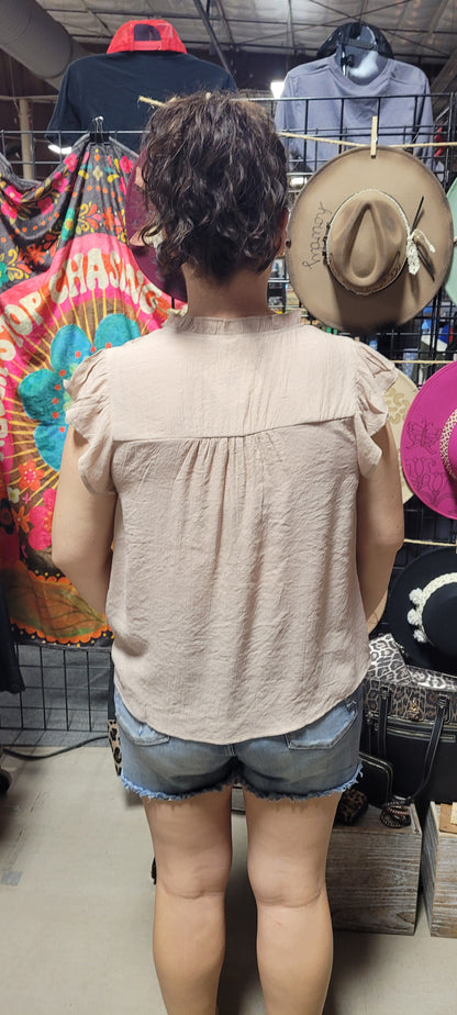 Freshen up your wardrobe with the "Faith Light Mocha" top! With split neckline, flutter sleeves, and lace detail, this top is perfect for any occasion. And tie it with a cute neck tie for an extra WOW factor. Be bold, be beautiful, and stay full of faith! Sizes small through large.