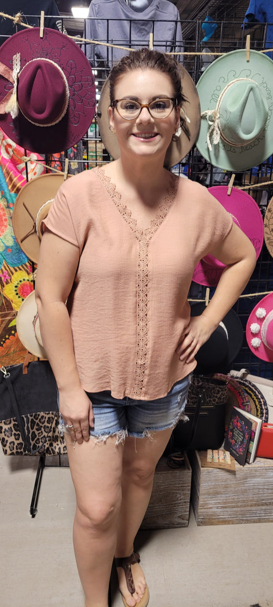 Step out in style with the "Roxie Sienna" top! Featuring a flattering V-neckline with lace edge and stylish short dolman sleeves, you'll be ready for the day without any extra effort. Who said looking great can't be effortless? Sizes small through large.