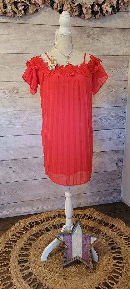 This stunning red pleated dress will make you want to go out dancing. It features flowy sleeves, adjustable spaghetti straps, cold shoulders, floral trim, and lining inside. It is shear, but not see through. Good for a night out with the girls! Don’t be afraid to get creative! Sizes small through large.