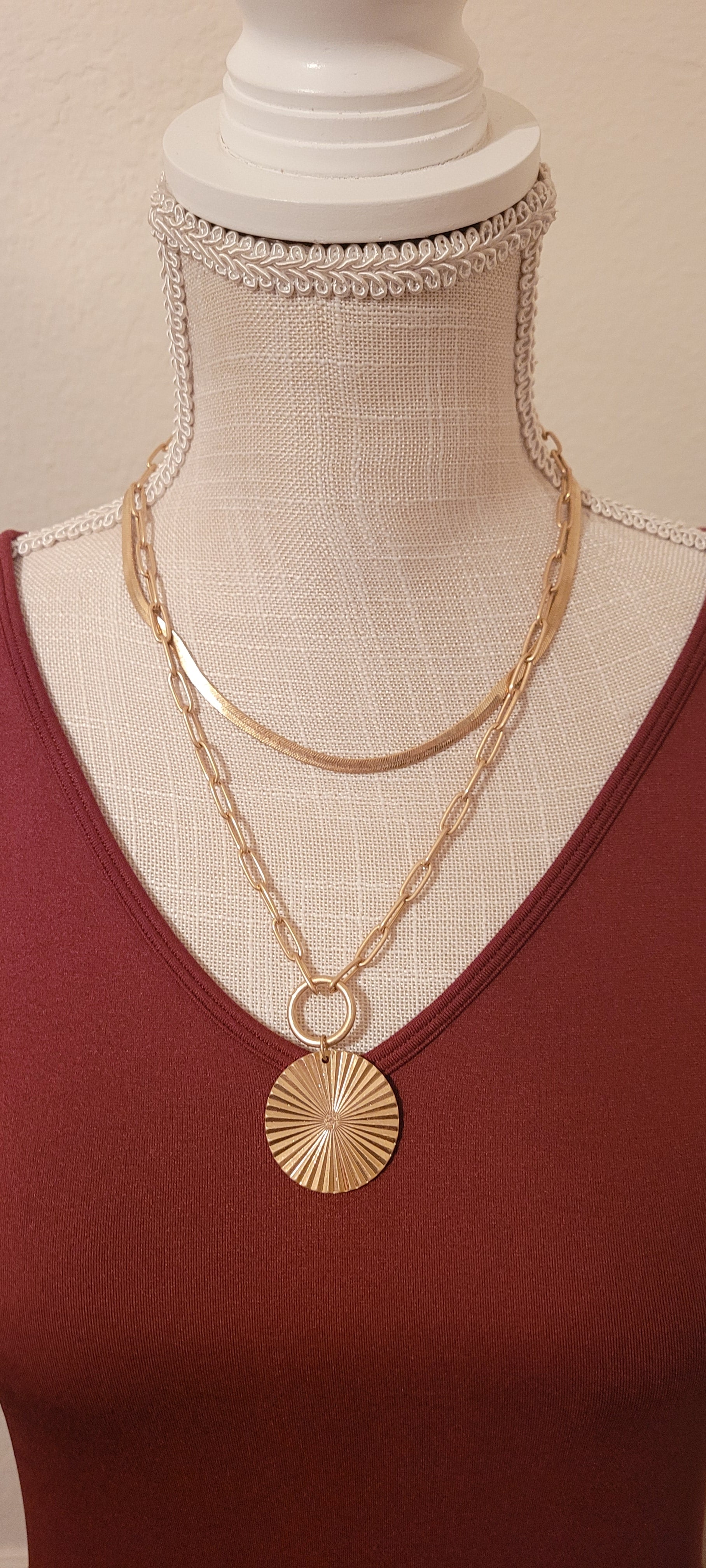 Approximate Length: Adjustable chain 16+2 inches Color: Gold snake chain and link chain with circle pendant Limited supply!