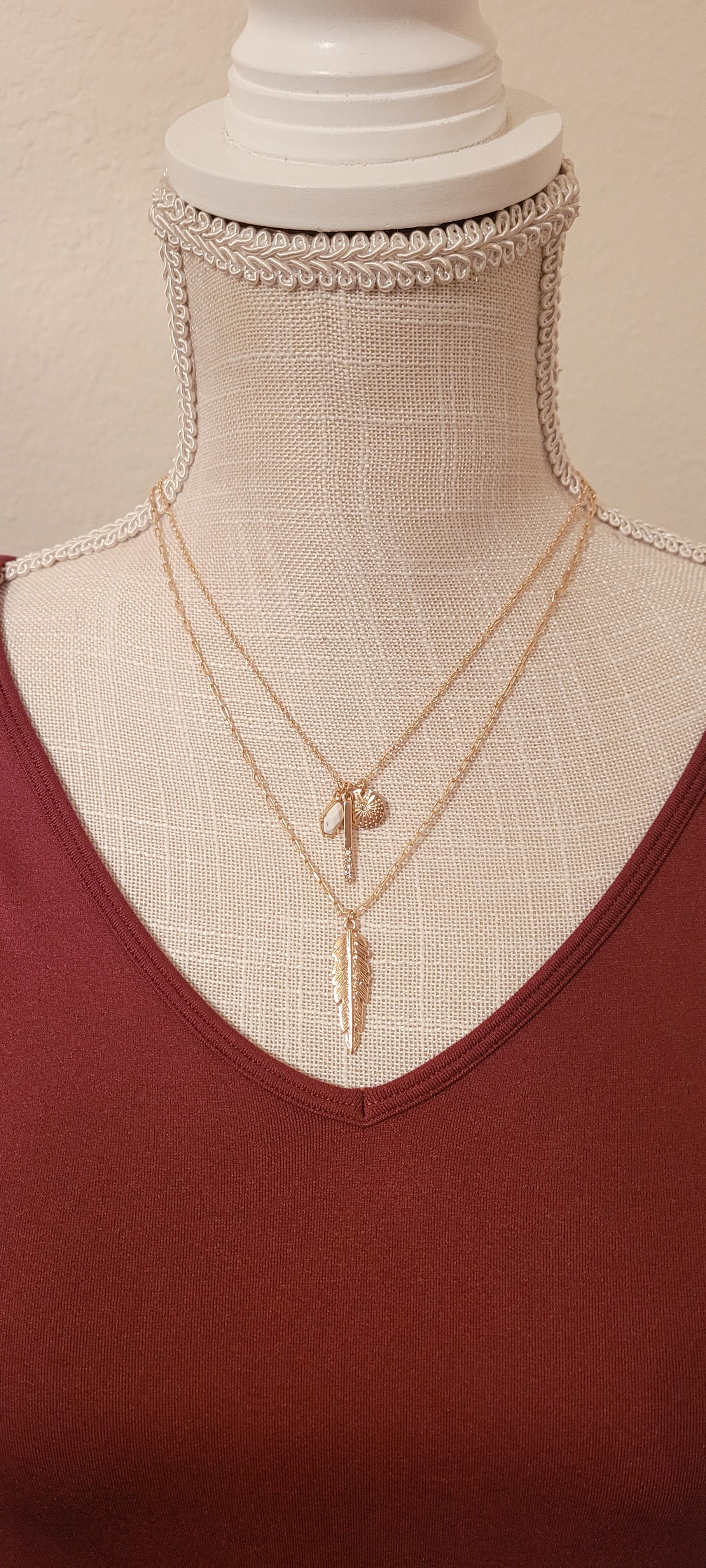 Approximate Length: Adjustable chain 16+2 inches Color: Gold link chain with feather, sun, bar with crystals pendants and small stone Limited supply!