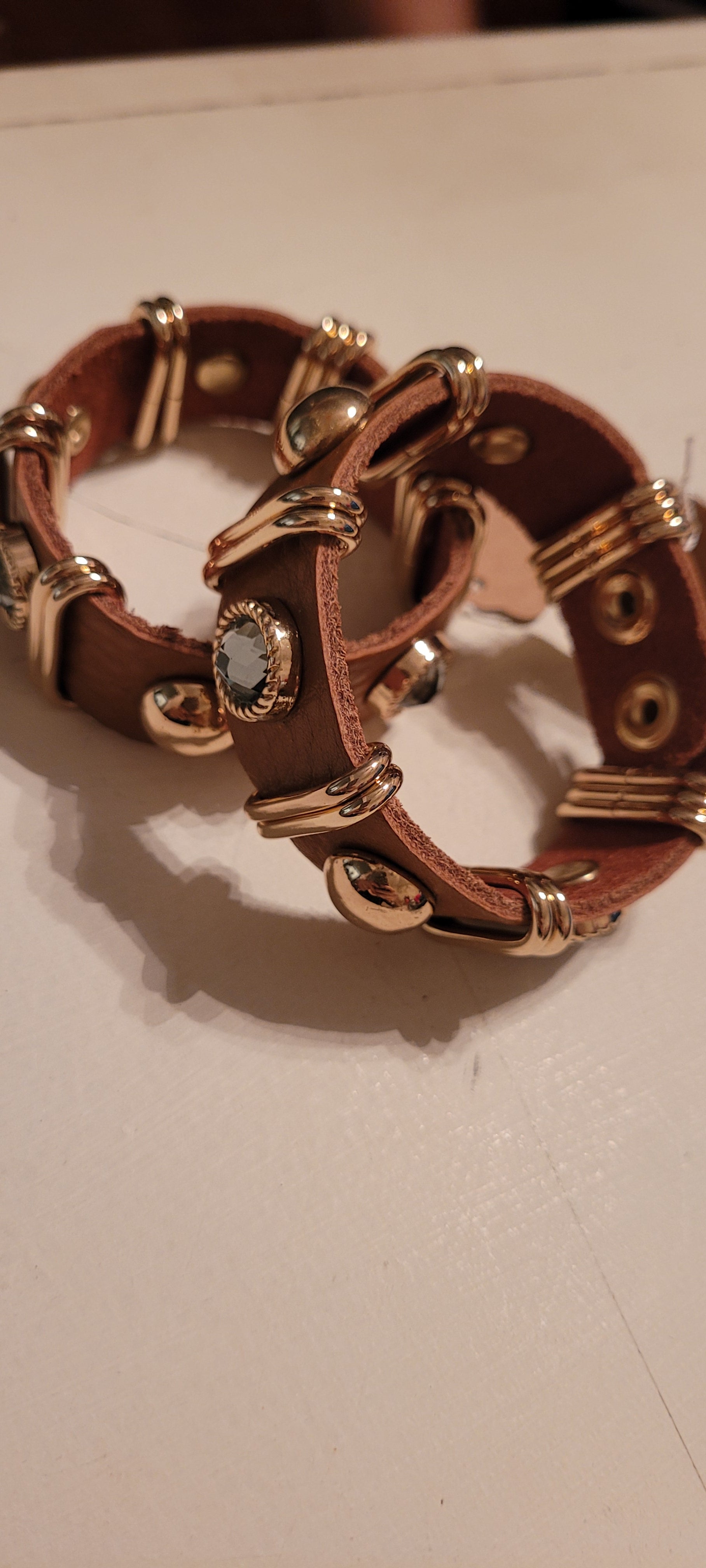 Brown leather bracelet with adjustable snap closure
