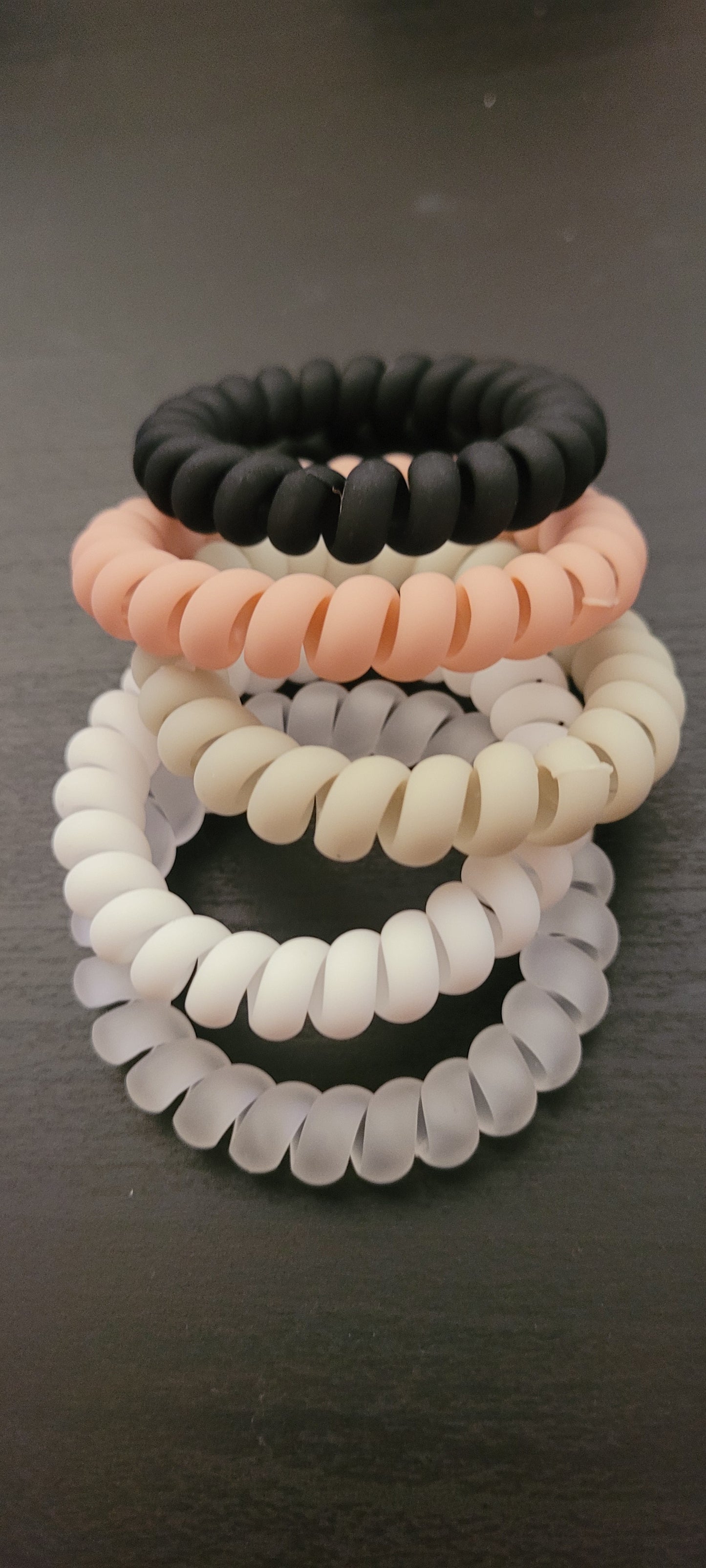 Boho hair tie coil (1: clear, 1: white, 1: black, 1: khaki, 2: dusty rose) Easy way to pull your hair up without pulling your hair out Wear as a bracelet  