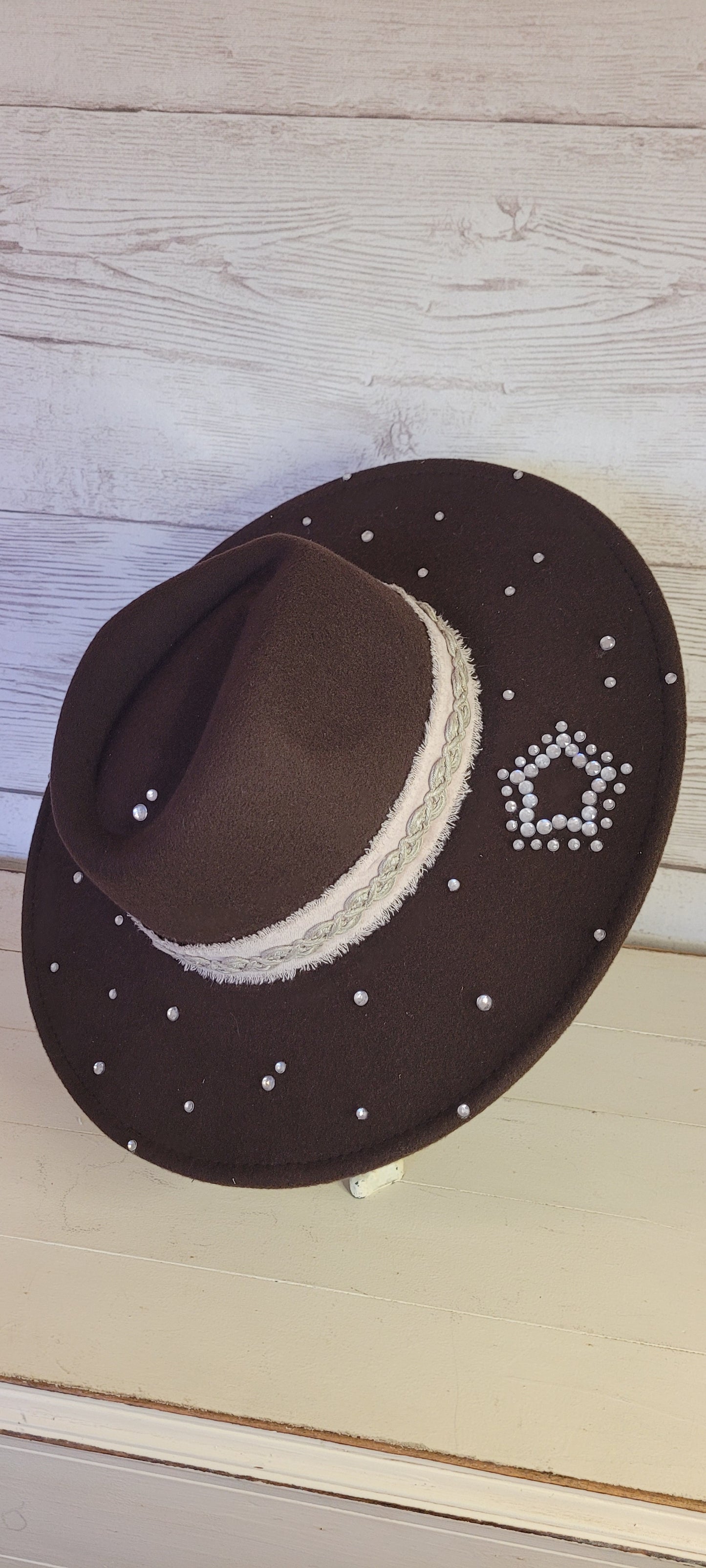 Features rhinestones, natural frayed velvet & lace ribbon, glitter star brooch & playing card Felt hat Flat brim 100% polyester Ribbon drawstring for hat size adjustment Head Circumference: 24" Crown Height: 5" Brim Length: 15.75" Brim Width: 14.5" Branded & numbered inside crown Custom designed by Kayla