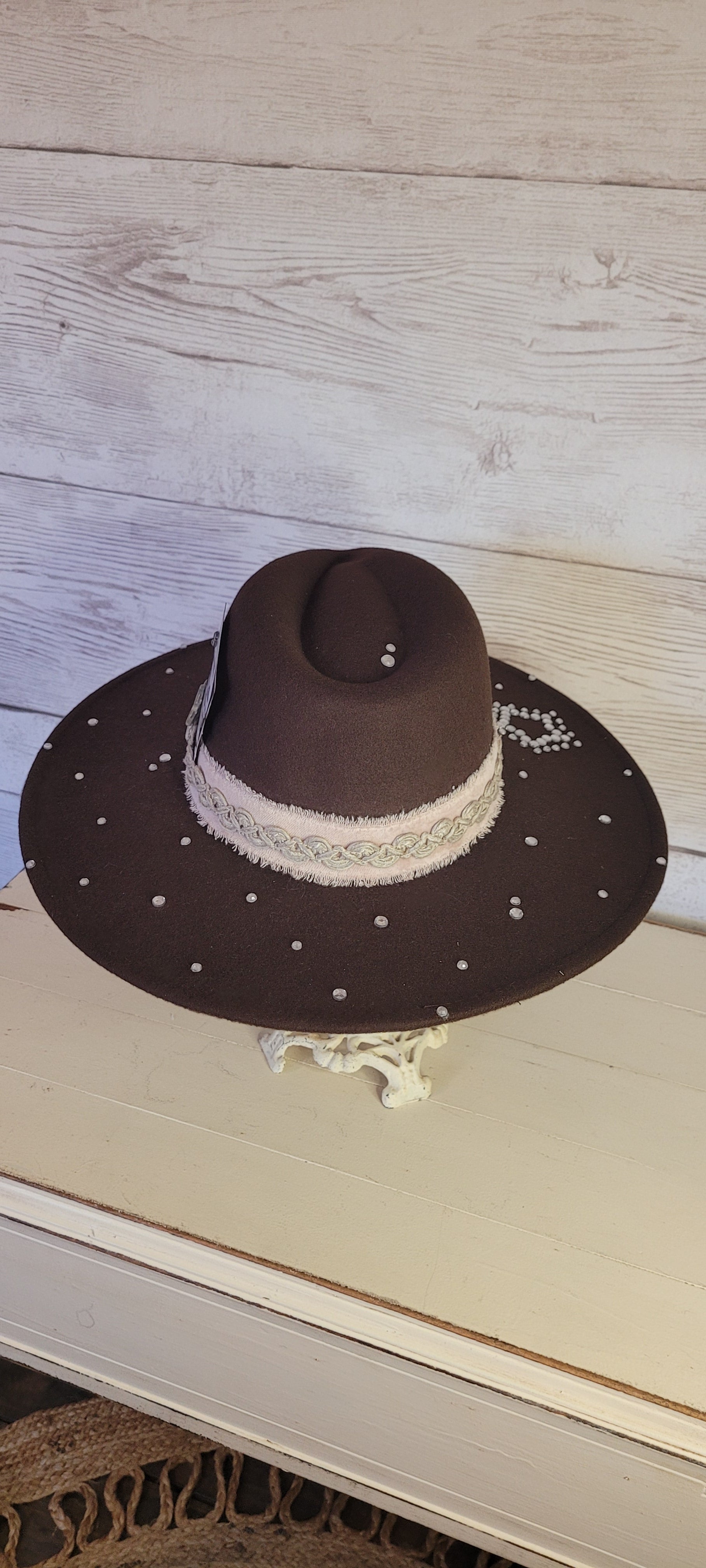 Features rhinestones, natural frayed velvet & lace ribbon, glitter star brooch & playing card Felt hat Flat brim 100% polyester Ribbon drawstring for hat size adjustment Head Circumference: 24" Crown Height: 5" Brim Length: 15.75" Brim Width: 14.5" Branded & numbered inside crown Custom designed by Kayla