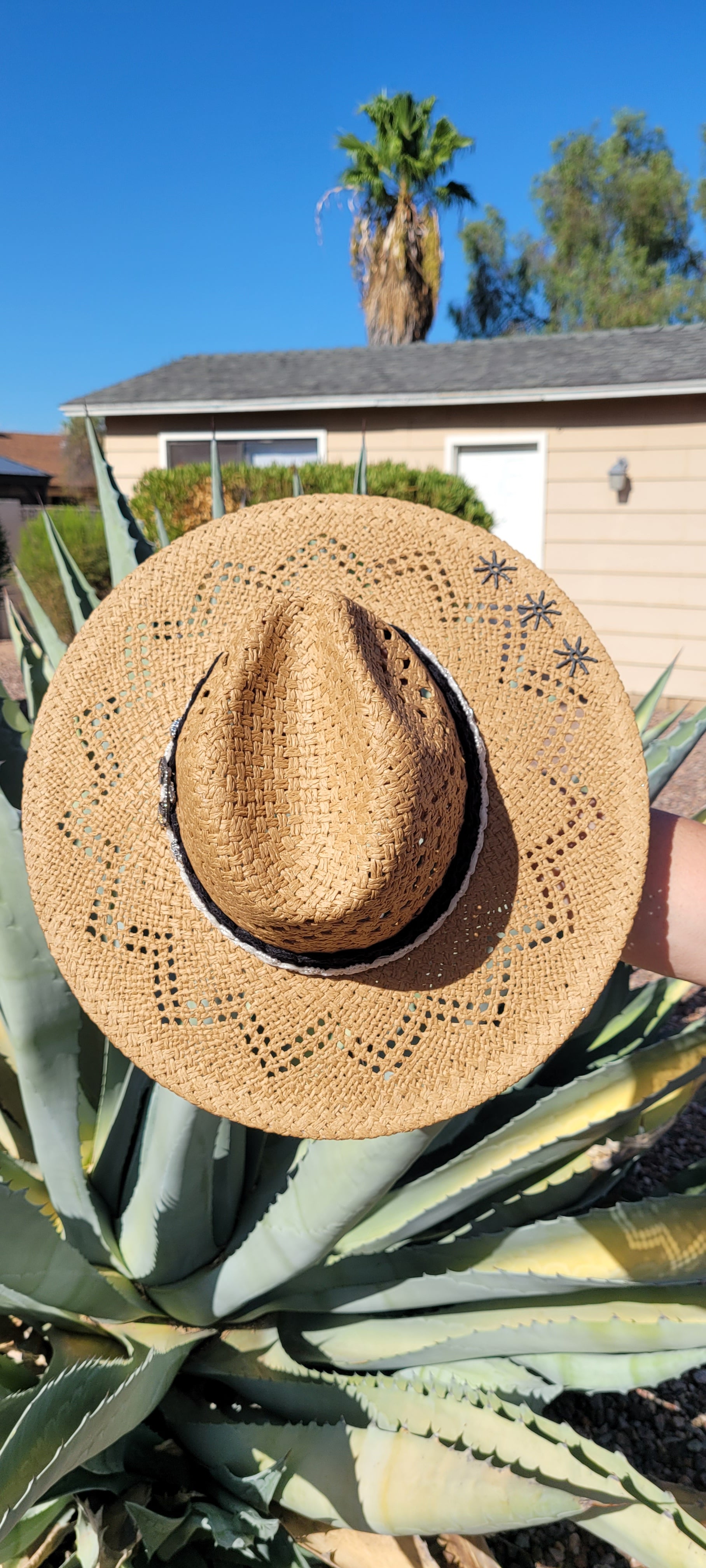 Lace ribbon, pearl ribbon, rowel (boot spur) pistol & decorative brooches Straw hat Flat brim 65% polyester and 35% cotton Ribbon drawstring for hat size adjustment Head Circumference: 24" Crown Height: 5" Brim Length: 15.75" Brim Width: 14.75" Branded & numbered inside crown Custom designed by Kayla