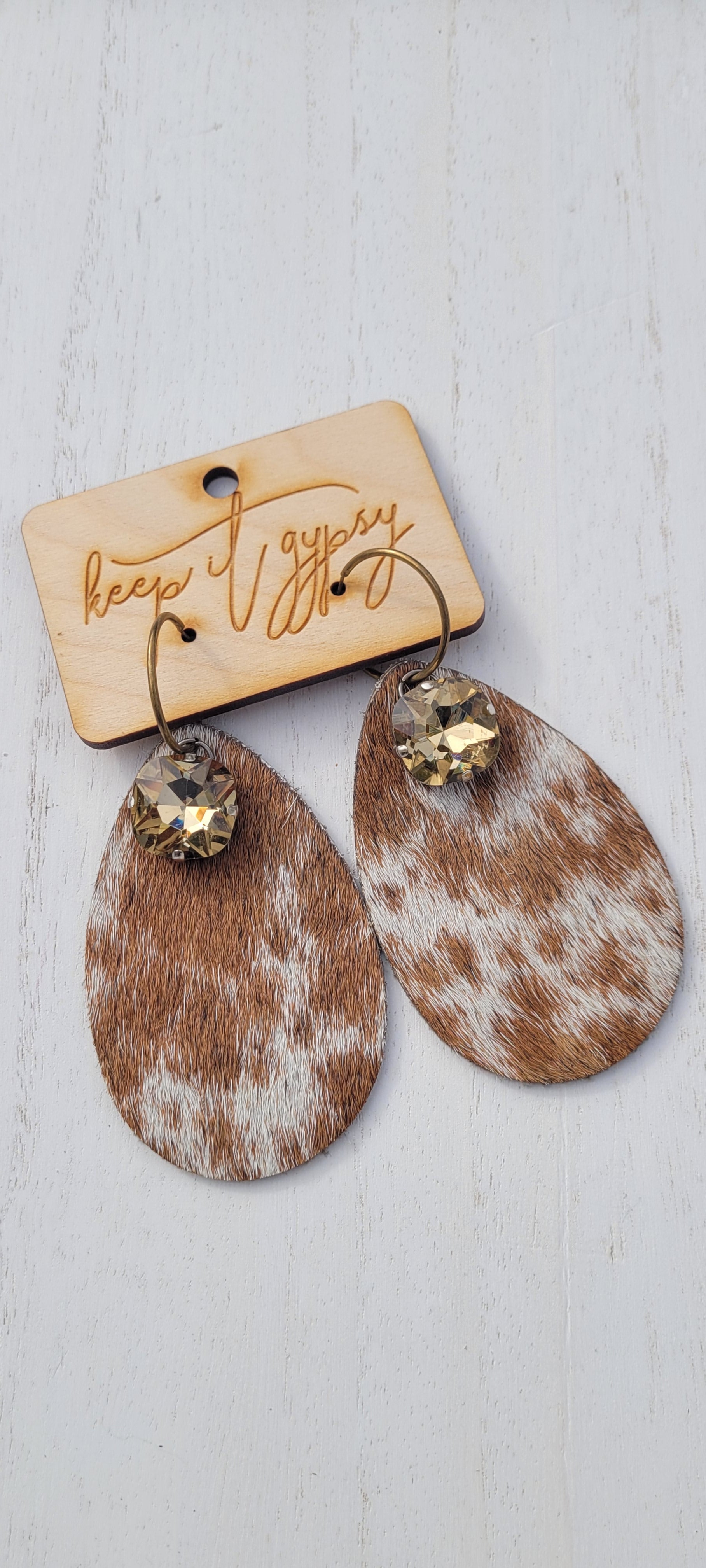 Upcycled Cow Print Cowhide Earrings Light Gold Crystals Brown and White Limited supply!    Due to the nature of leather/suede, small variances of color in the skin may occur, this is in no way considered a defect. These are inherent characteristics of leather/suede and will enhance the individual look of your garment.   